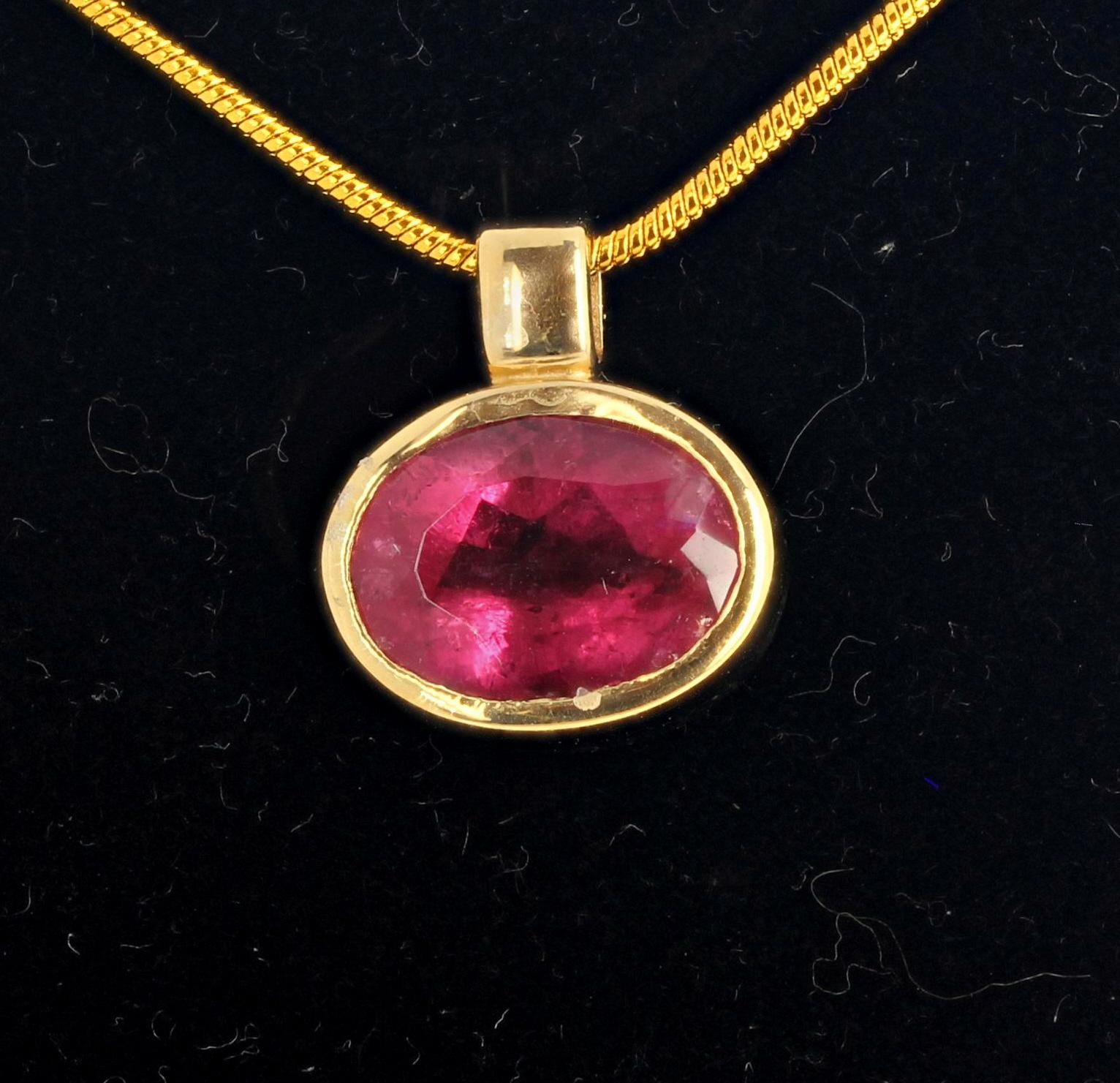 Gemjunky Glowing 5 Carat pinky red natural Rubelite Tourmaline (12 mm x 10 mm) set in this lovely 18Kt yellow gold pendant.  It hangs approximately 15 mm,  Chain not included.  