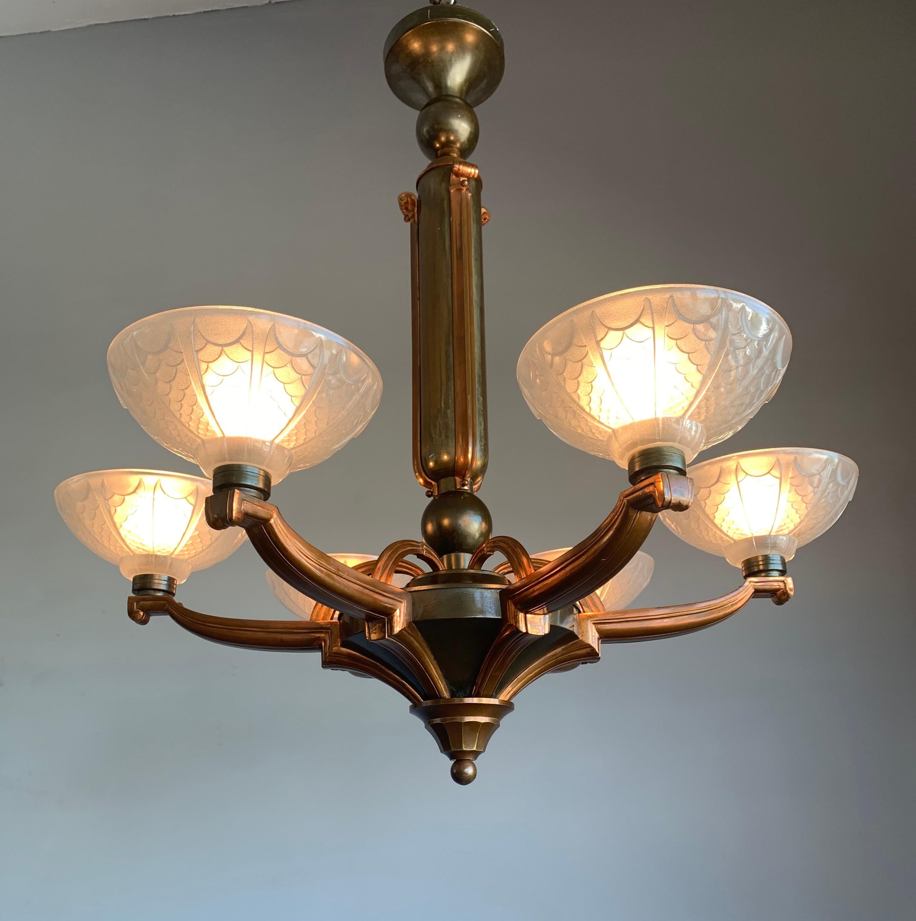 Truly beautiful and top quality made Art Deco pendant, 1920s.

The magnificent design of this grand Art Deco chandelier is one of the most beautiful we have ever seen. This light fixture is like an archetype of the Art Deco era, because even people