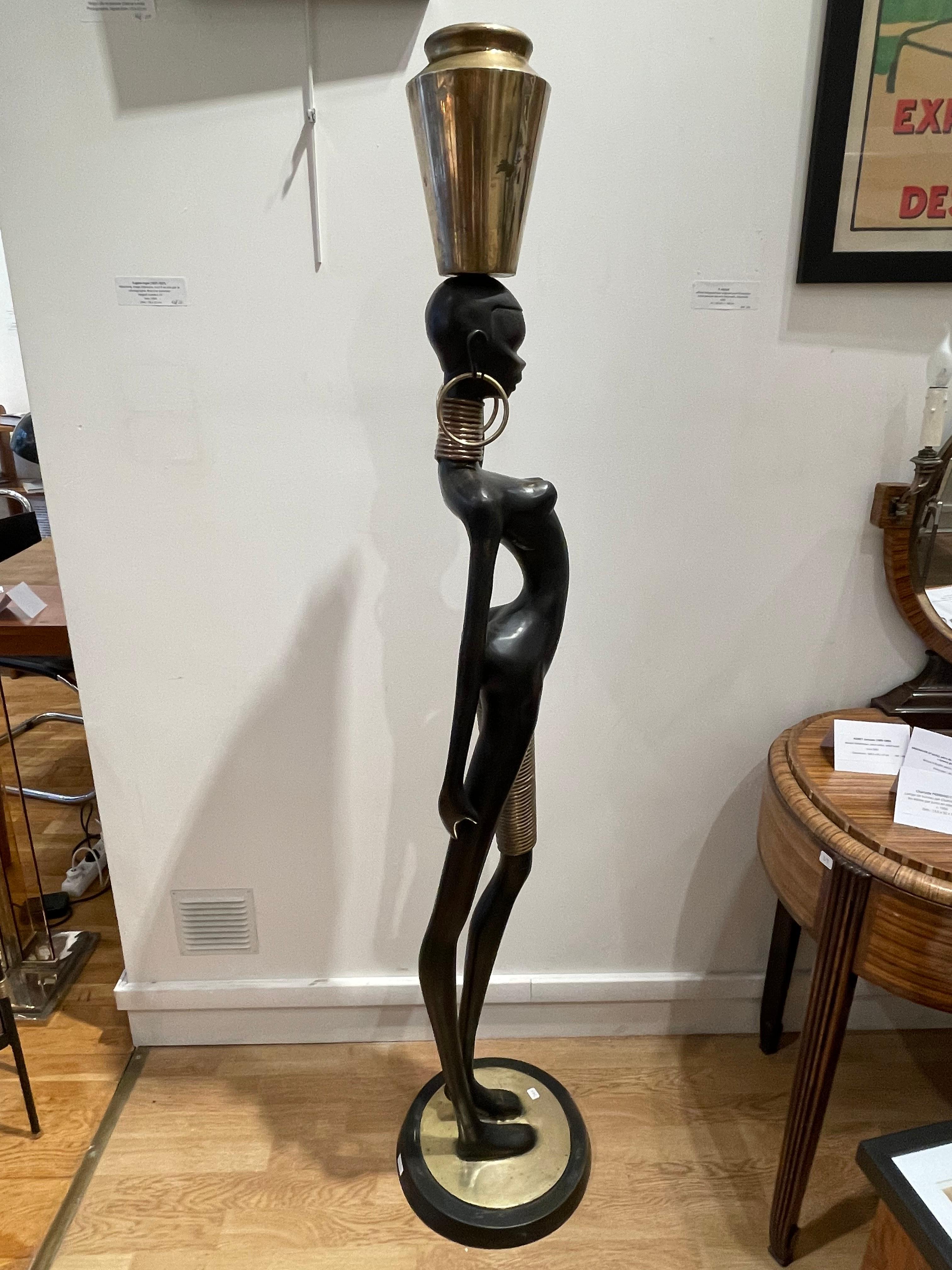 Patinated Stunning Bronze of an African lady carrying water, in the style of Karl Hagenaue For Sale