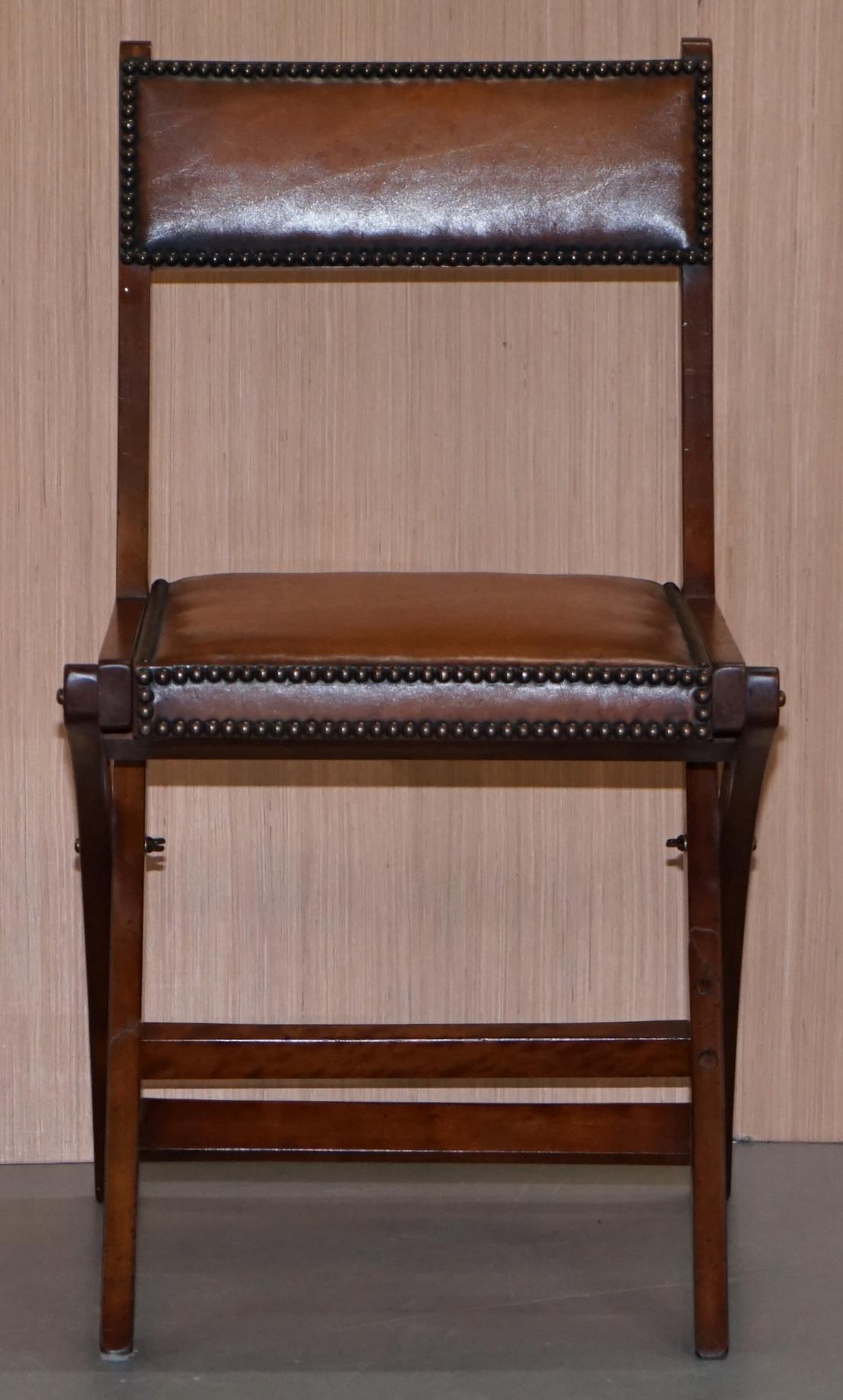 We are delighted to offer for sale this stunning handmade in England R.E.H Kennedy for Harrods London mahogany and brown leather military Campaign desk chair

This is a very good looking, comfortable and compact office chair, the frame is solid