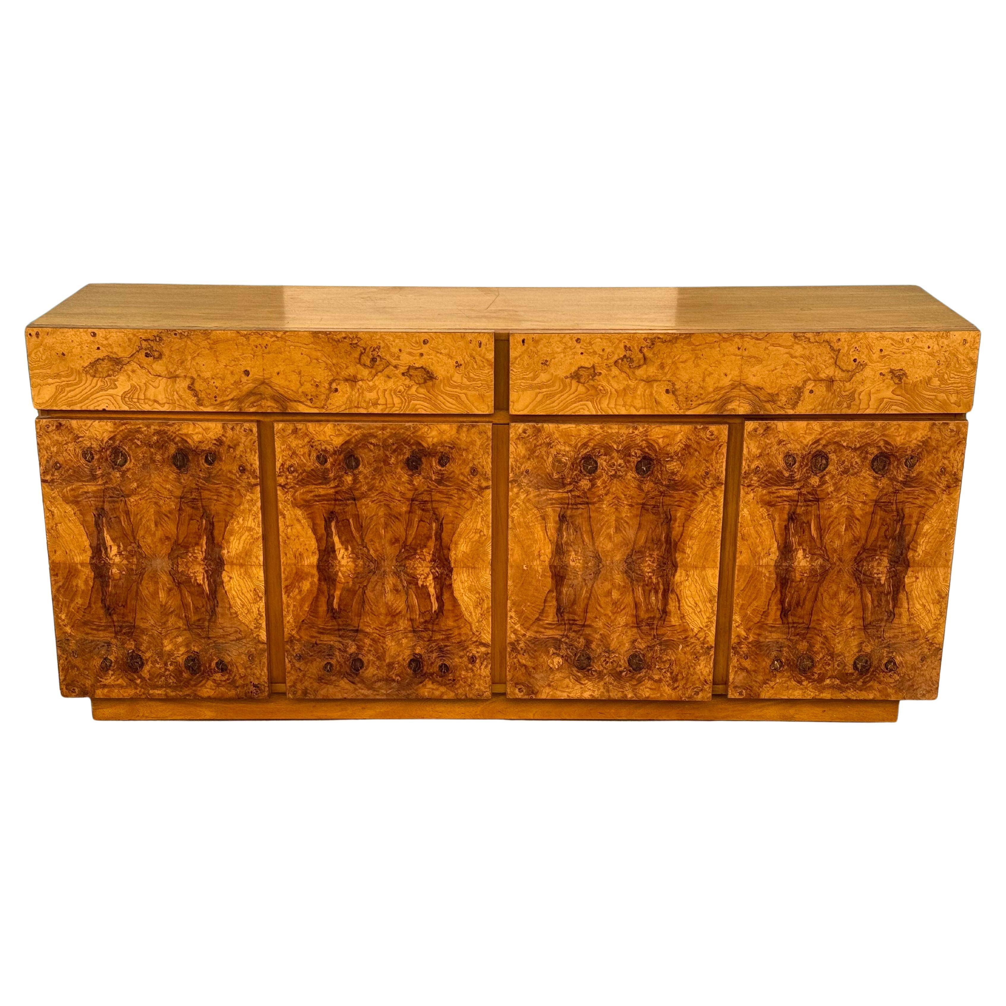 A gorgeous highly figured burl grain wood credenza dresser by Roland Carter for Lane. Circa 1970s.

There are two drawers, one on each side. The large cabinet doors conceal three different shelves. 

Very good vintage condition. Minor flaws as