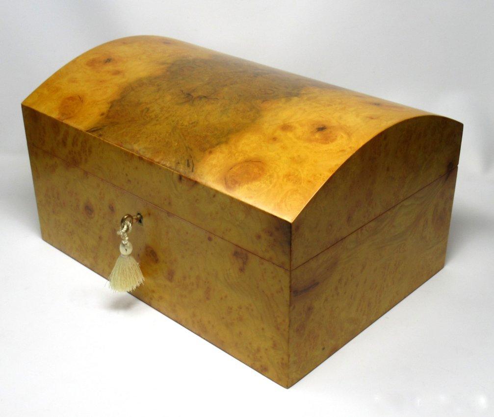 Stunning burr burl walnut wood ladies or gentleman's jewelry box casket made by Manning of Ireland of generous proportions, with interior and lift out tray lined in luxury dark navy blue lining.
This rare Acacia burl walnut wood (California - Know