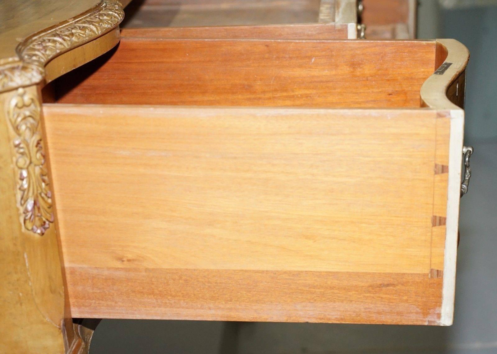 We are delighted to offer for sale this lovely handmade in England Art Deco Burr Walnut sideboard with lion hair paw feet

A very well made and good-looking piece, the finish is period so lightly distressed around the edges and with normal wear.