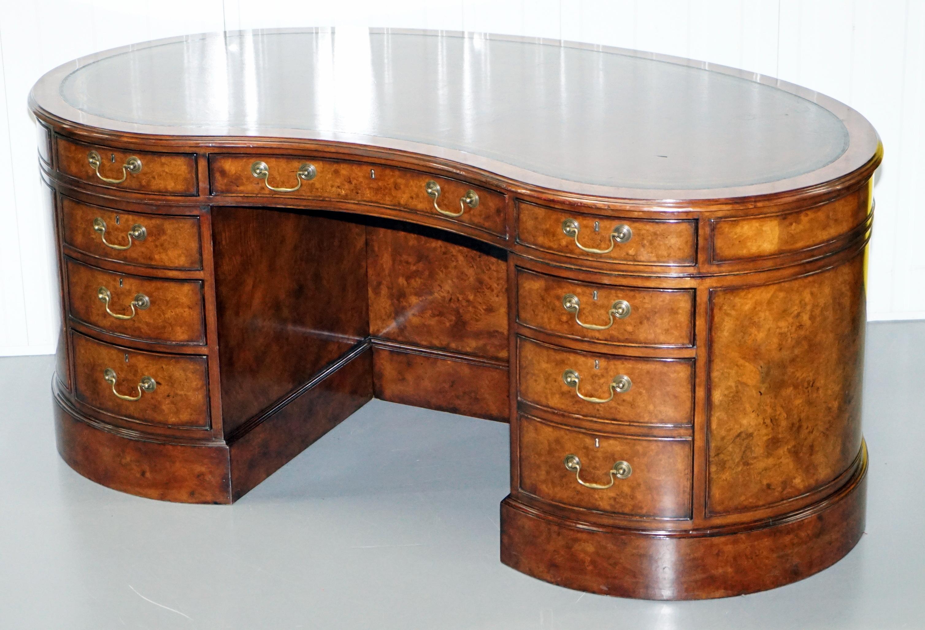 We are delighted to this stunning burr walnut kidney shaped desk with built in bookshelf and back cupboards

These desks are very expensive and rarely come on the preowned market. The desk is after a design by Gillows of Lancaster and London which