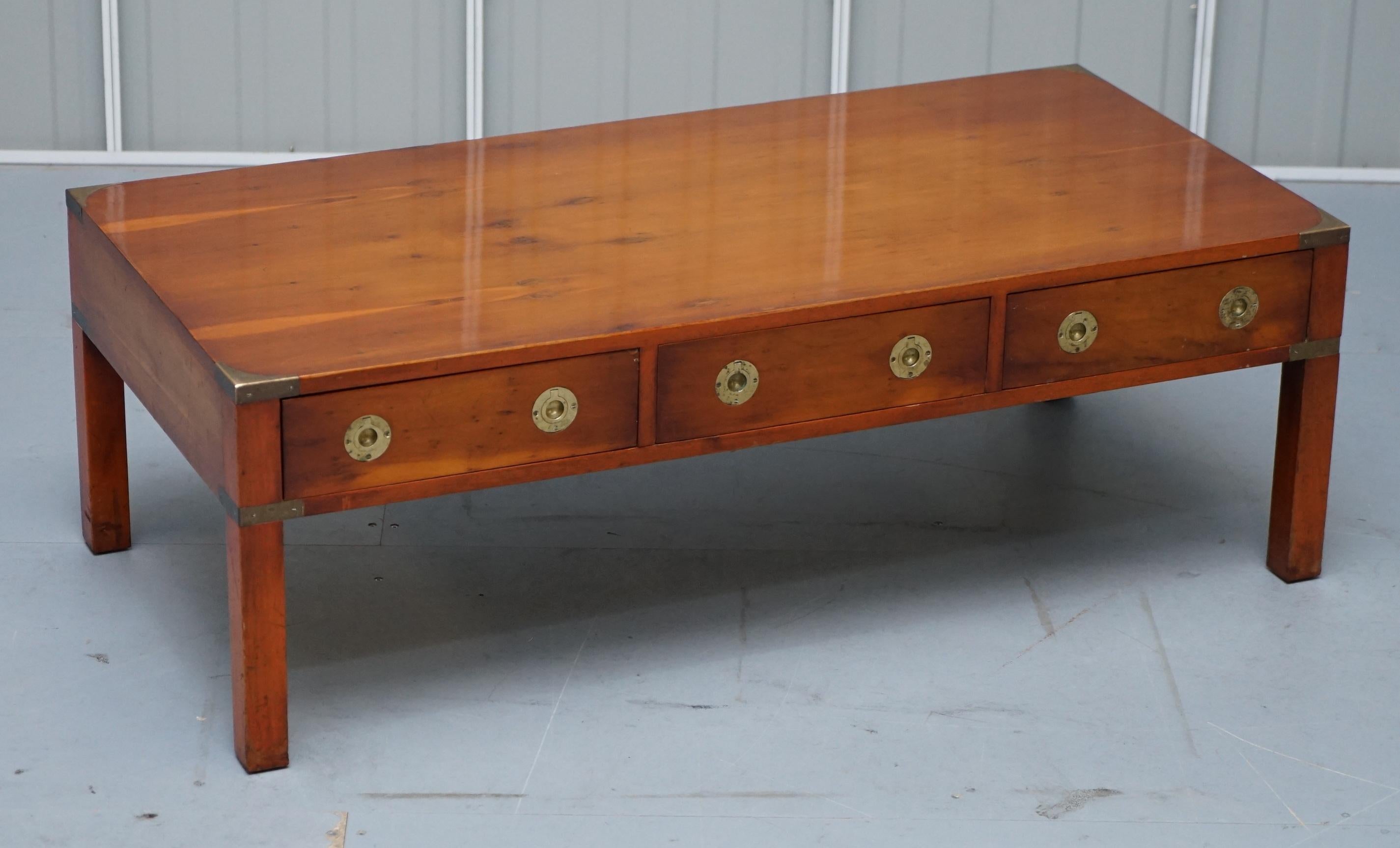 We are delighted to this stunning burr yew wood Military Campaign coffee table with three drawers on each side made by Kennedy and retailed through Harrods London

A good looking well made and decorative coffee table, we have restored it to