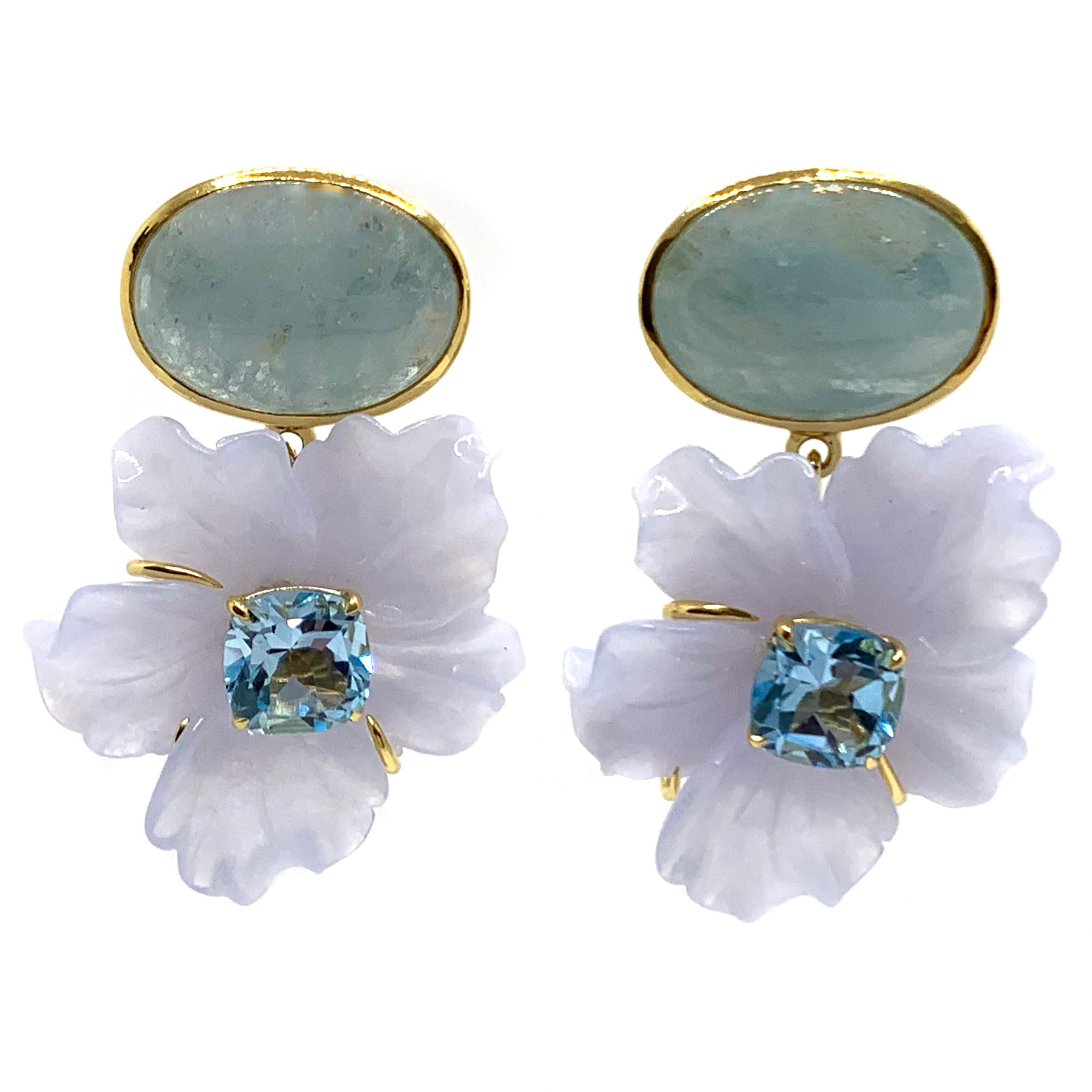 Stunning Cabochon Aquamarine and Carved Chalcedony Flower Drop Earrings

This gorgeous pair of earrings features oval cabochon-cut aquamarine and beautifully 3D carved Chalcedony flower with cushion-cut sky blue topaz in center, handset in 18k
