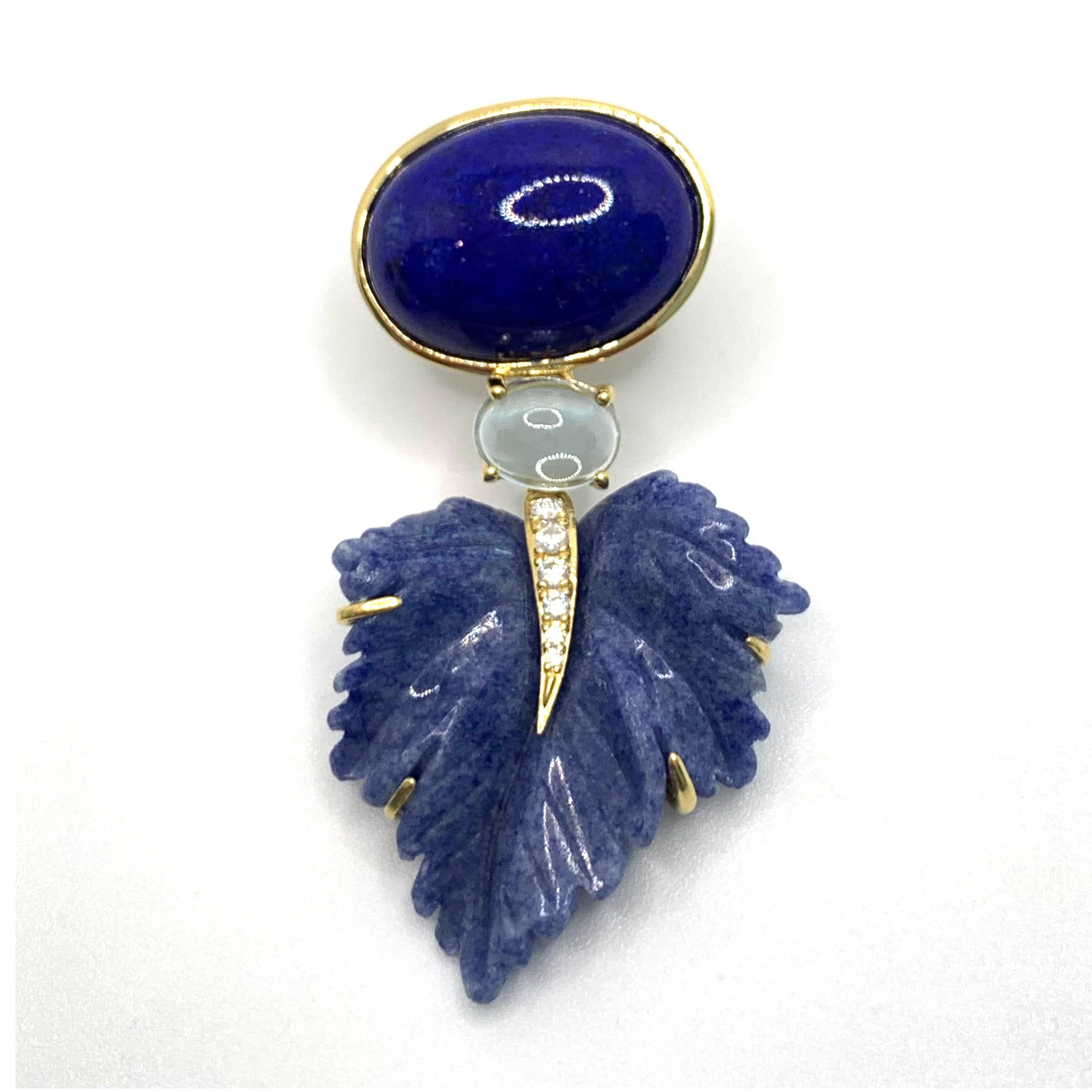 Stunning Cabochon Lapis Lazuli and Carved Dumortierite Leaf Drop Earrings

This gorgeous pair of earrings features oval cabochon-cut lapis lazuli and beautifully 3D carved blue dumortierite leaf with cabochon-cut sky blue topaz in middle, handset in