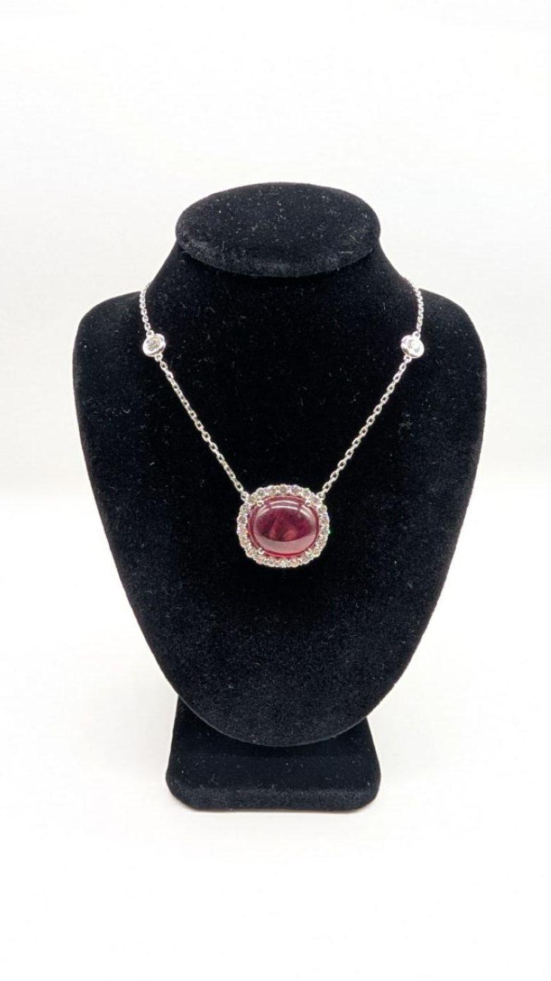 Exceptional 14K White Gold Necklace Featuring a 26.01 Carat Ruby Cabochon and 3.50 Carats of Diamonds

An extraordinary display of elegance and sophistication, this striking necklace is crafted in 14K white gold and centers around a magnificent