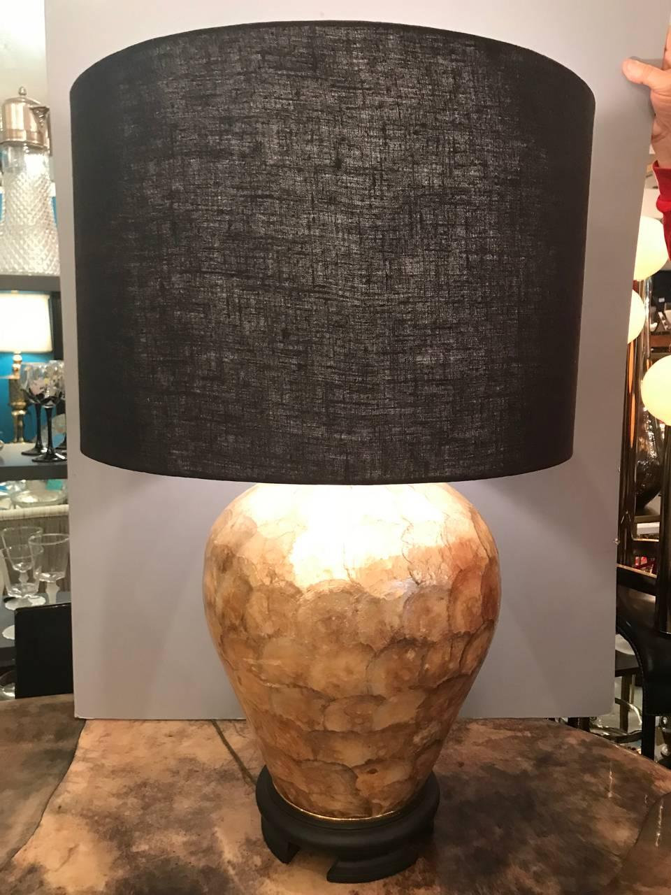 This is a rich-toned capiz shell lamp by the famed Marbro Lamp company. The rich gold tones of the shells add warmth and glitz. Shade is included.