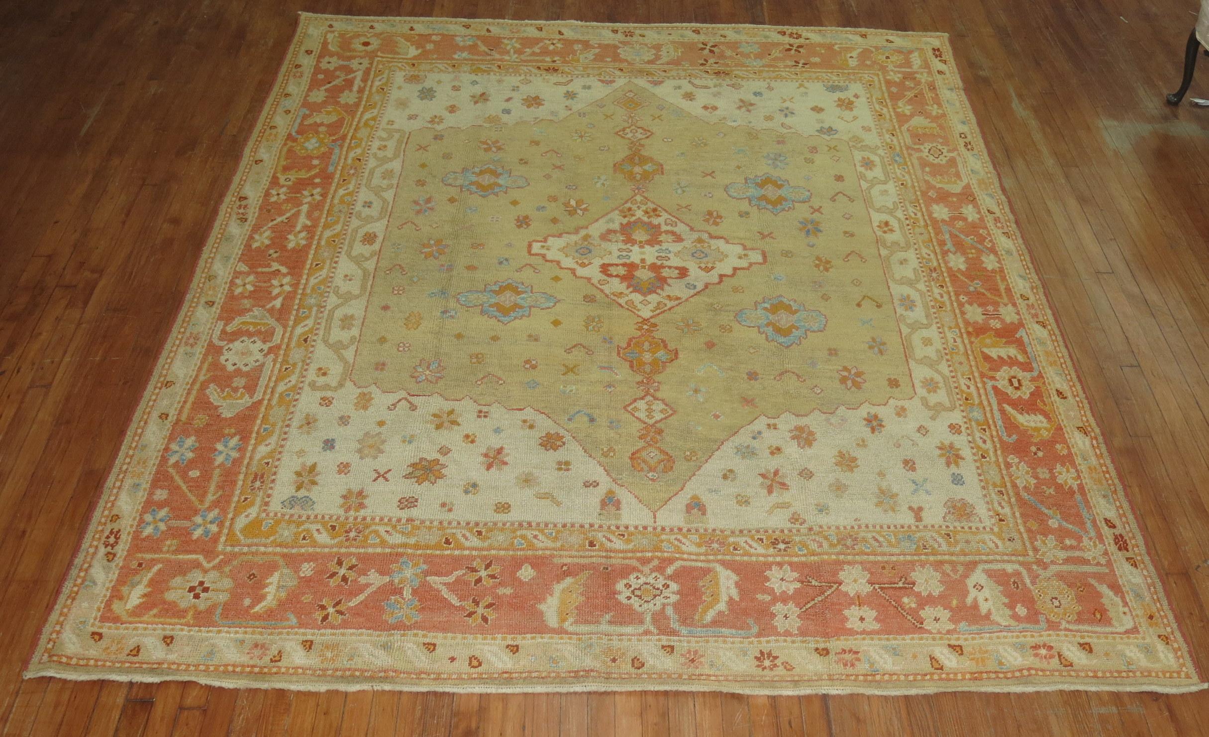 Stunning early 20th century ivory field orange antique Turkish Oushak rug some hints of light blue and coral accents on a caramel background

Measures: 8'5
