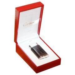 Superbe briquet ovale Cartier Décor cuir brun garni de palladium Papiers en boîte