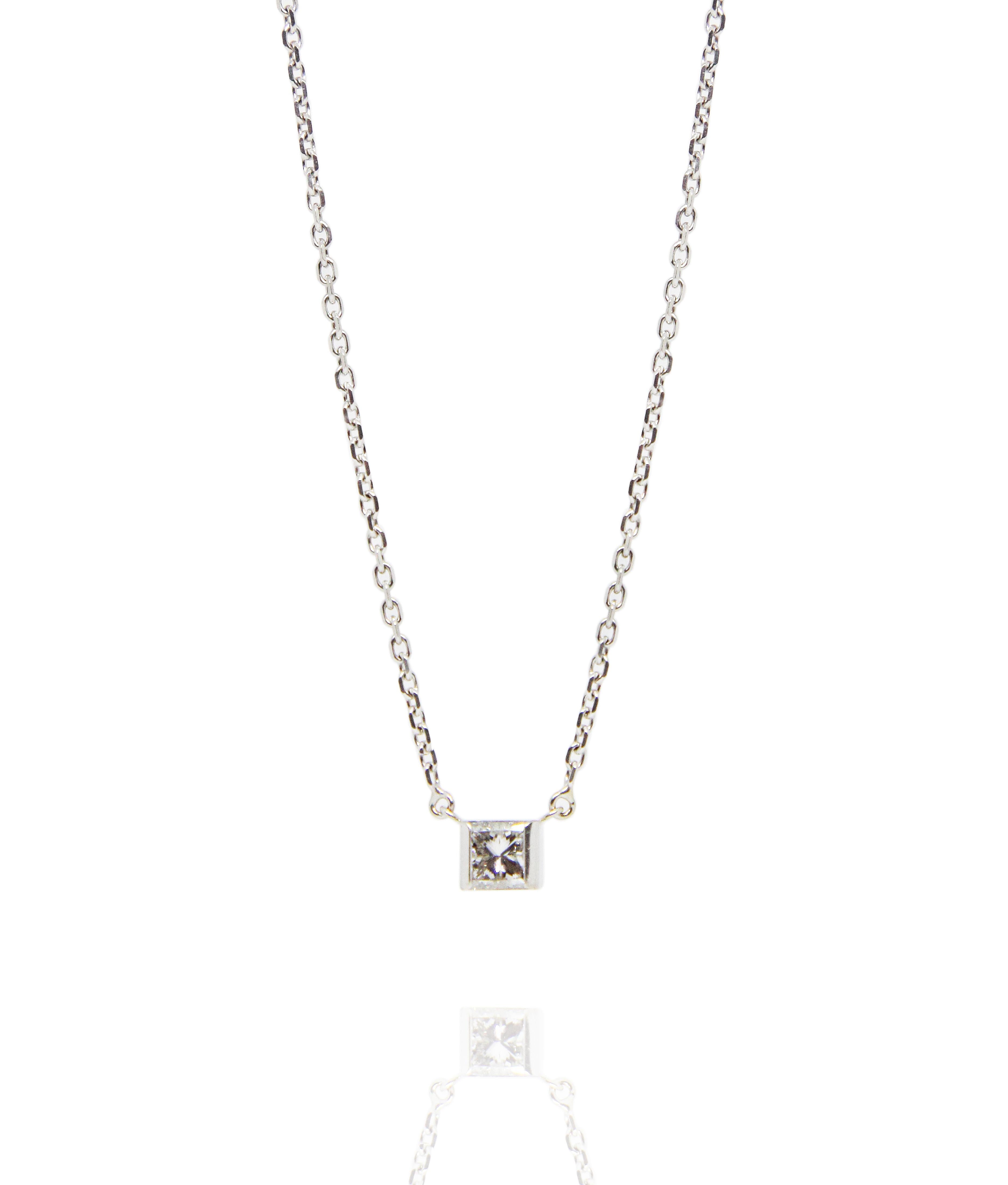 Rare Cartier White Gold Diamond Necklace
18K white gold Cartier chain necklace with fixed pendant 
1 solitaire diamond 0.7ct in princess cut
Cartier CC logo on back
„Cartier“ engraved on side
Double spring ring security closures
Total weight 4.5g