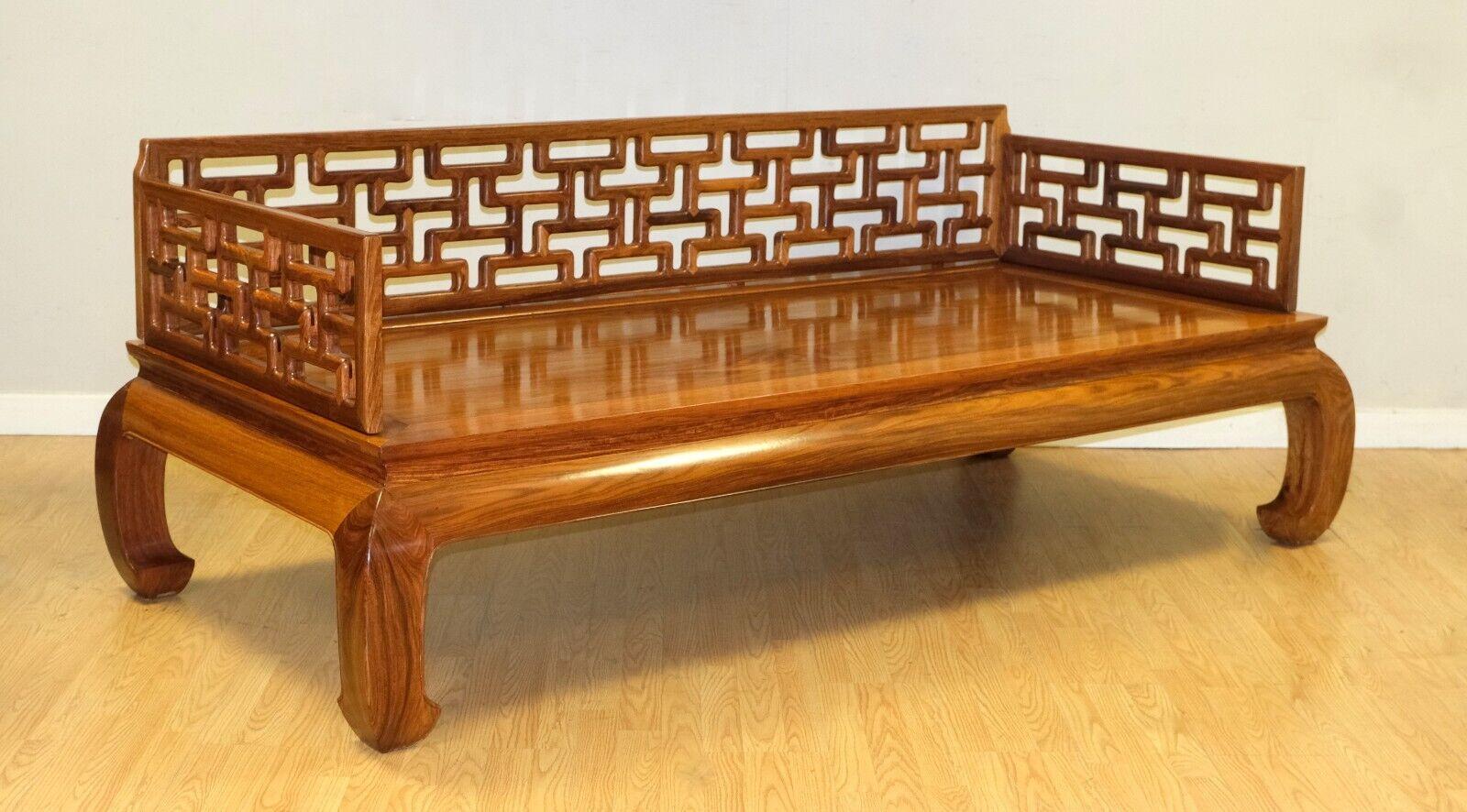 We are delighted to offer for sale this stunning Ming Elmwood Day or Opium bed raised on horse hoof solid feet.

This sturdy and beautiful hardwood, Lou Han bed is a unique, Chinese, traditional piece. The side and back shows lovely carved details