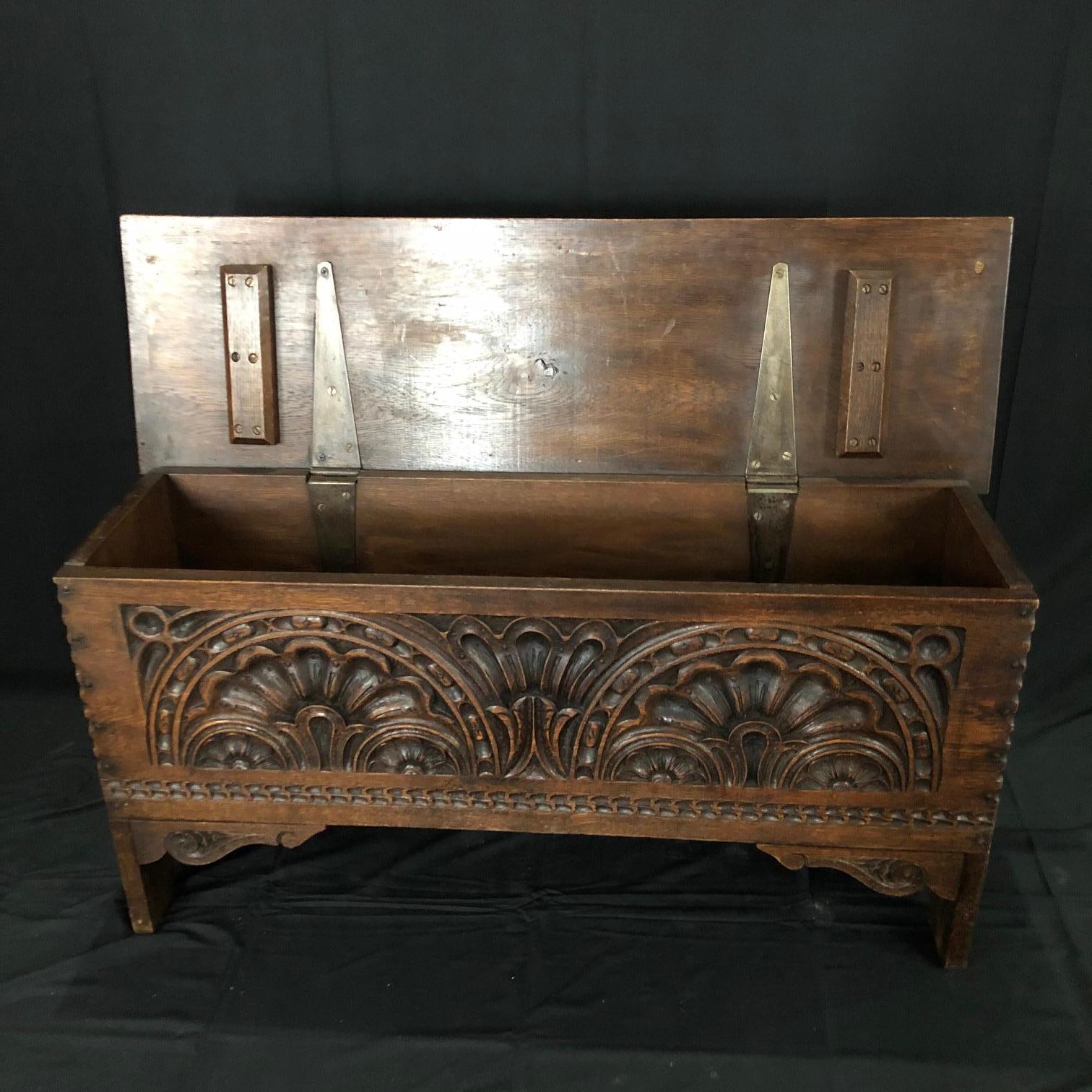 Intricately carved petite French coffer or trunk having smooth surface with very little graining and carved scalloped detail. This nicely proportioned coffer features a lift top revealing a storage area, all resting on carved end feet.
#5117.