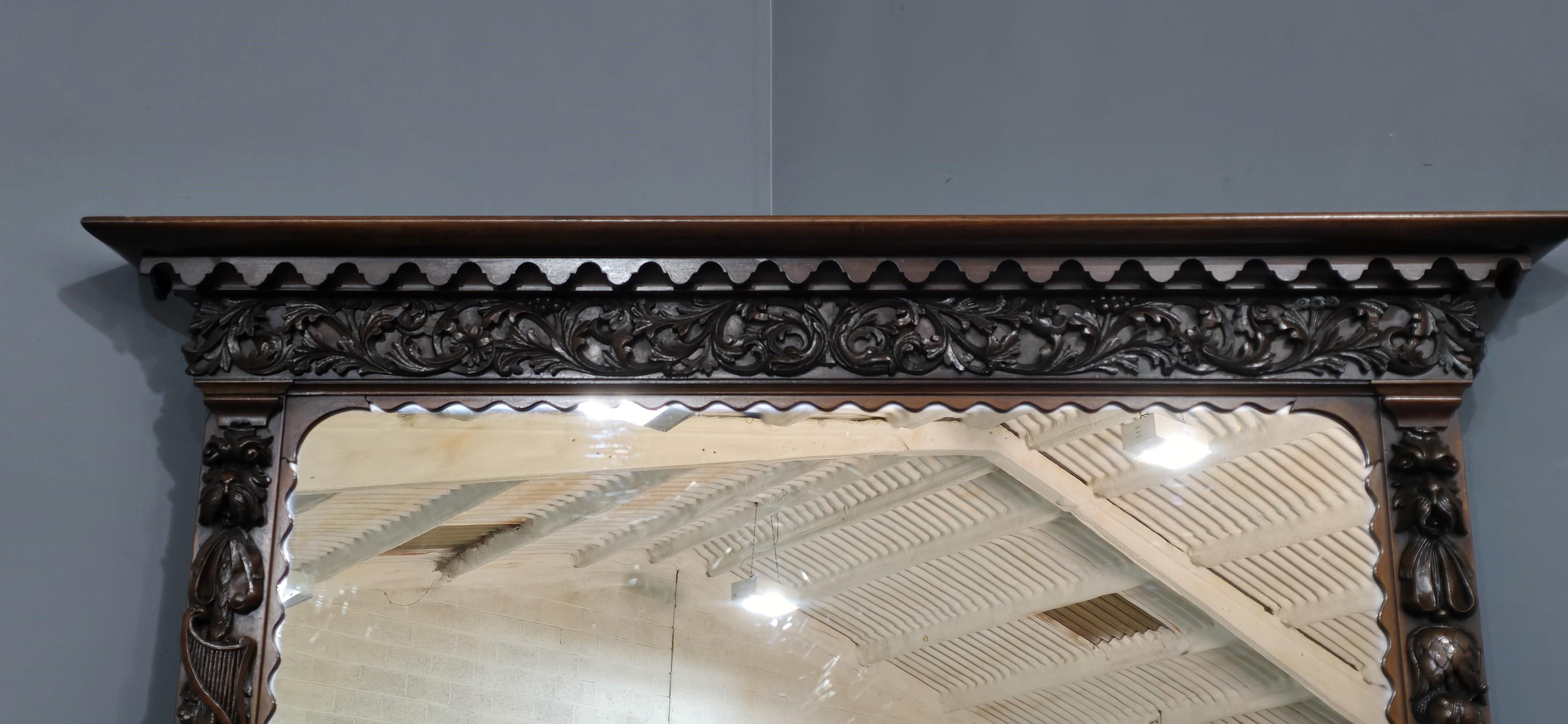 A stunning Edwardian mahogany overmantle mirror, with very crisp carvings, original plate glass (slight imprefections) otherwise in immaculate condition.

54