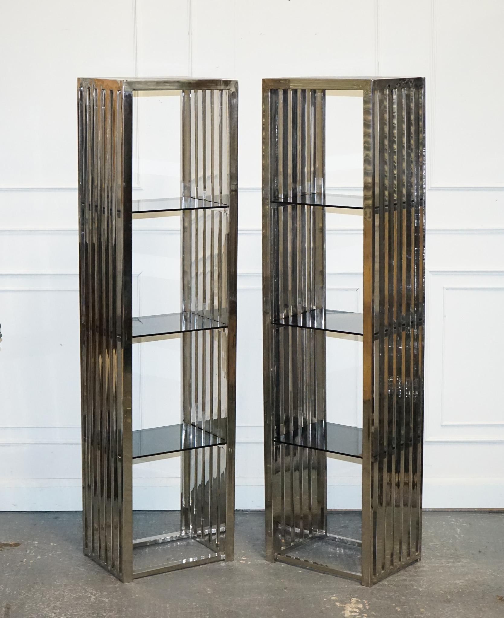 
We are delighted to offer for sale this Stunning Casa Padrino Stainless Steel Pair Of Bookcases And Smoked Glass Shelf.

The Casa Padrino stainless steel pair of bookcases exudes modern elegance with its sleek design and polished finish. These