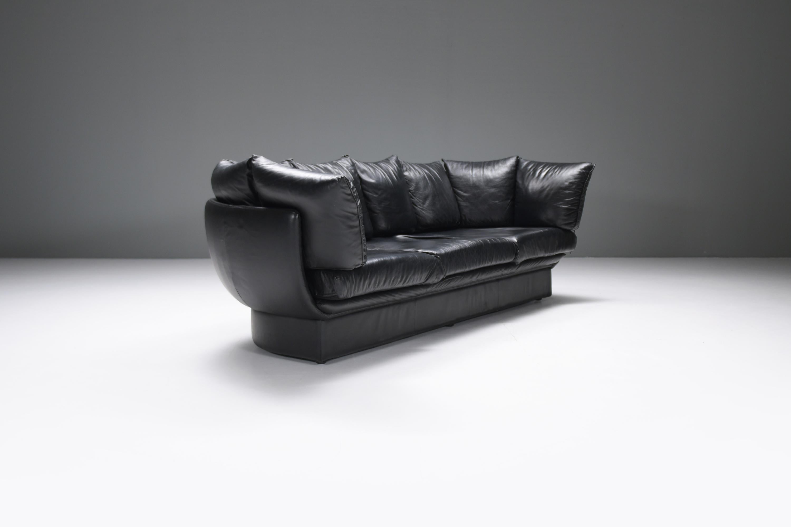 
Extremely rare, stylish and elegant ‘Champagne’ sofa in its original vintage black leather.
Designed & produced by LEV & LEV in Italy in the 90s.

This beauty is a rare find on the second hand market.  
Its sensual shapes make it a real eye-catcher