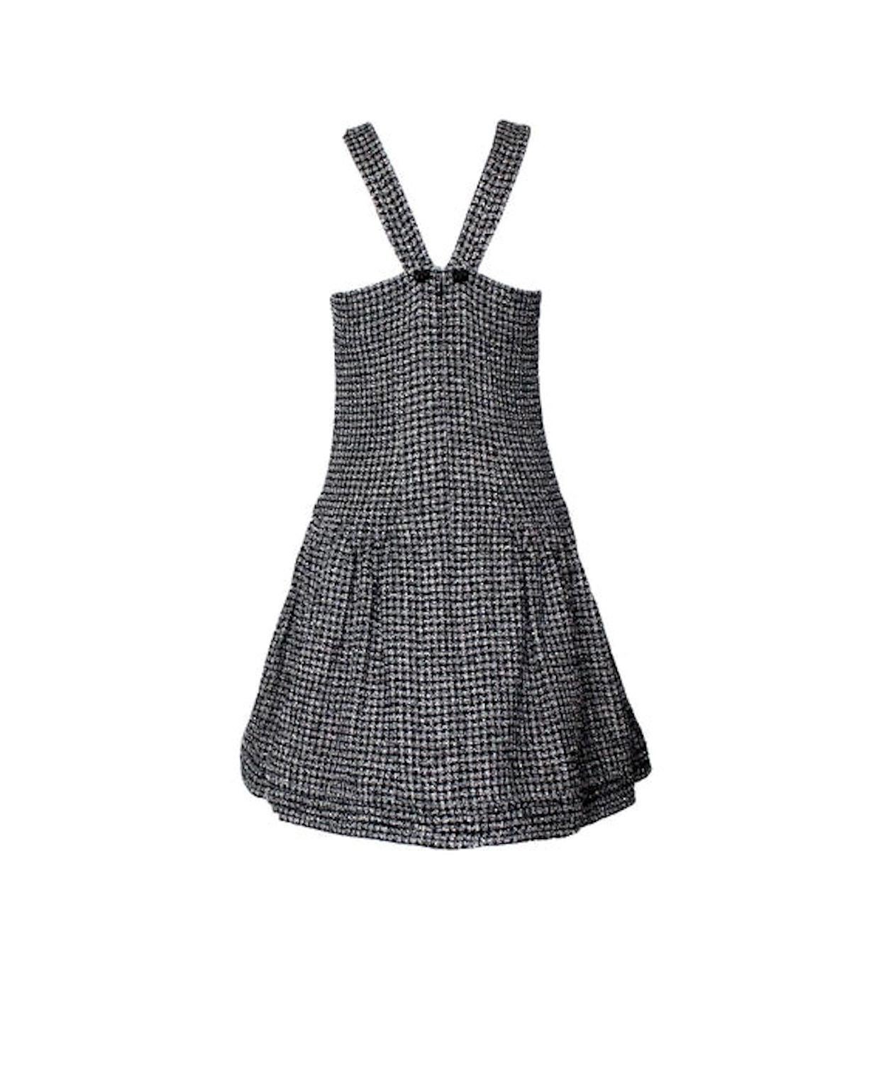 Amazing dress by Chanel
Made of exquisite tweed fabric produced by Maison Lesage for Chanel
Dress features a round neck and wide skirt with pleats
Two hidden pockets
Decorative back with two classy CC logo buttons
Fully lined with CC logo silk
Size