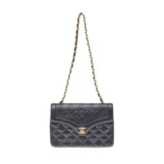 Stunning Chanel Mini classic bag in quilted navy blue leather and gold hardware