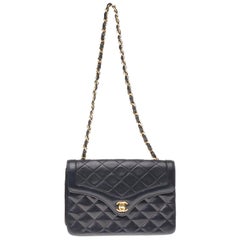 Stunning Chanel Mini classic bag in quilted navy blue leather and gold hardware