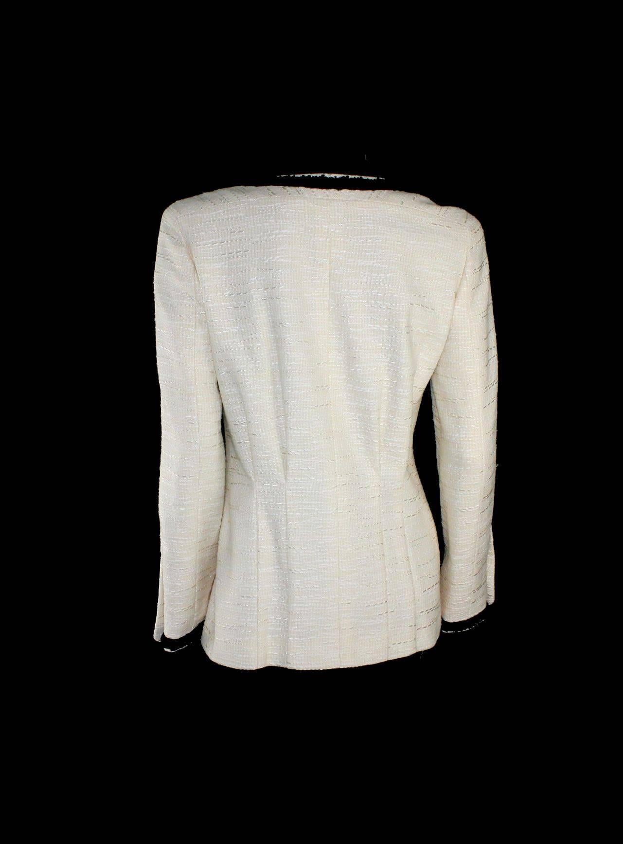 Chanel signature jacket
Designed by Karl Lagerfeld
Classic Chanel monochrome signature style that never goes out of style
Ivory tweed with black trimming
Two front pockets
Beautifully fitted back
CC logo buttons
Made in France
Dry Clean Only
Costume
