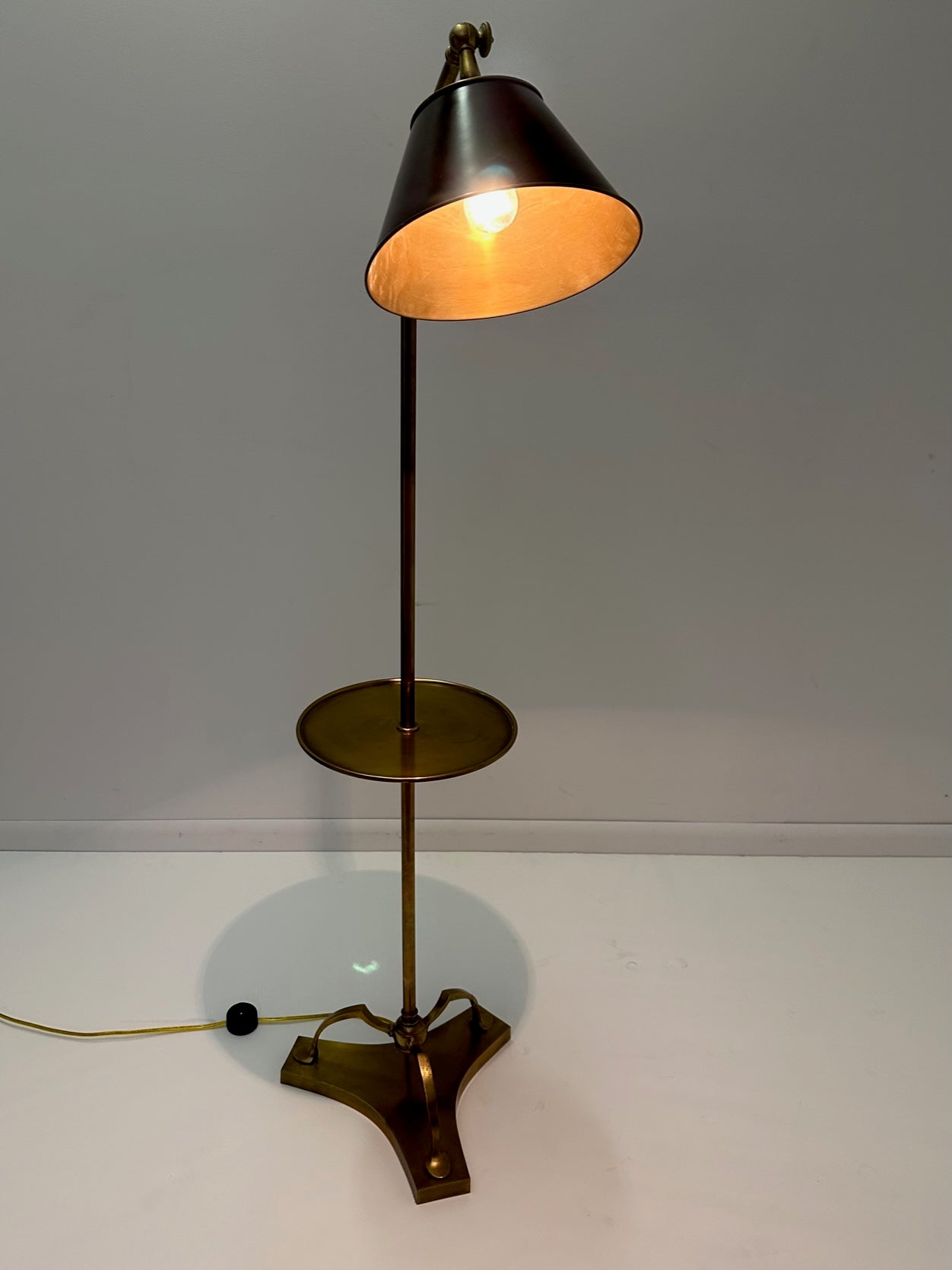 Handsome Chapman solid brass floor lamp having ebonized black adjutable shade and round 11.5 diameter table.  Shade is 10