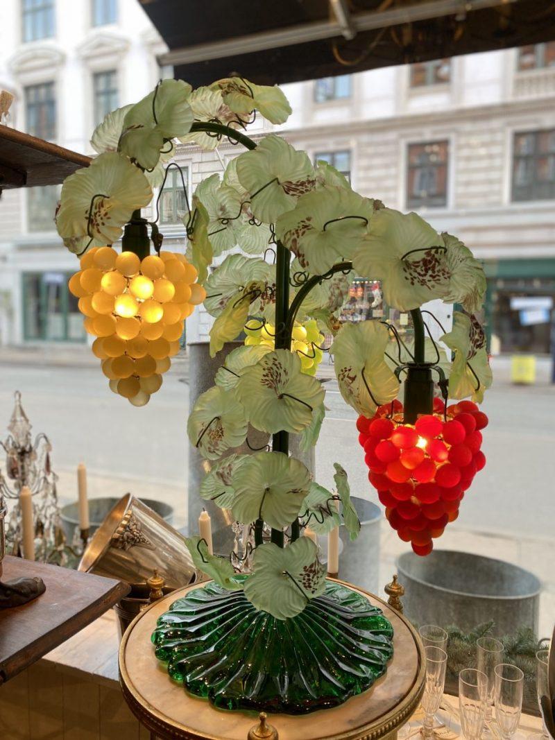 Funky and fabulous Murano table lamp, from 1960s Italy.  Gorgeously created delicate touches of glass flowers and colourful bunches of grapes, as well as 3 light sources.

A different and cheerful lamp that will clearly demand attention in a modern