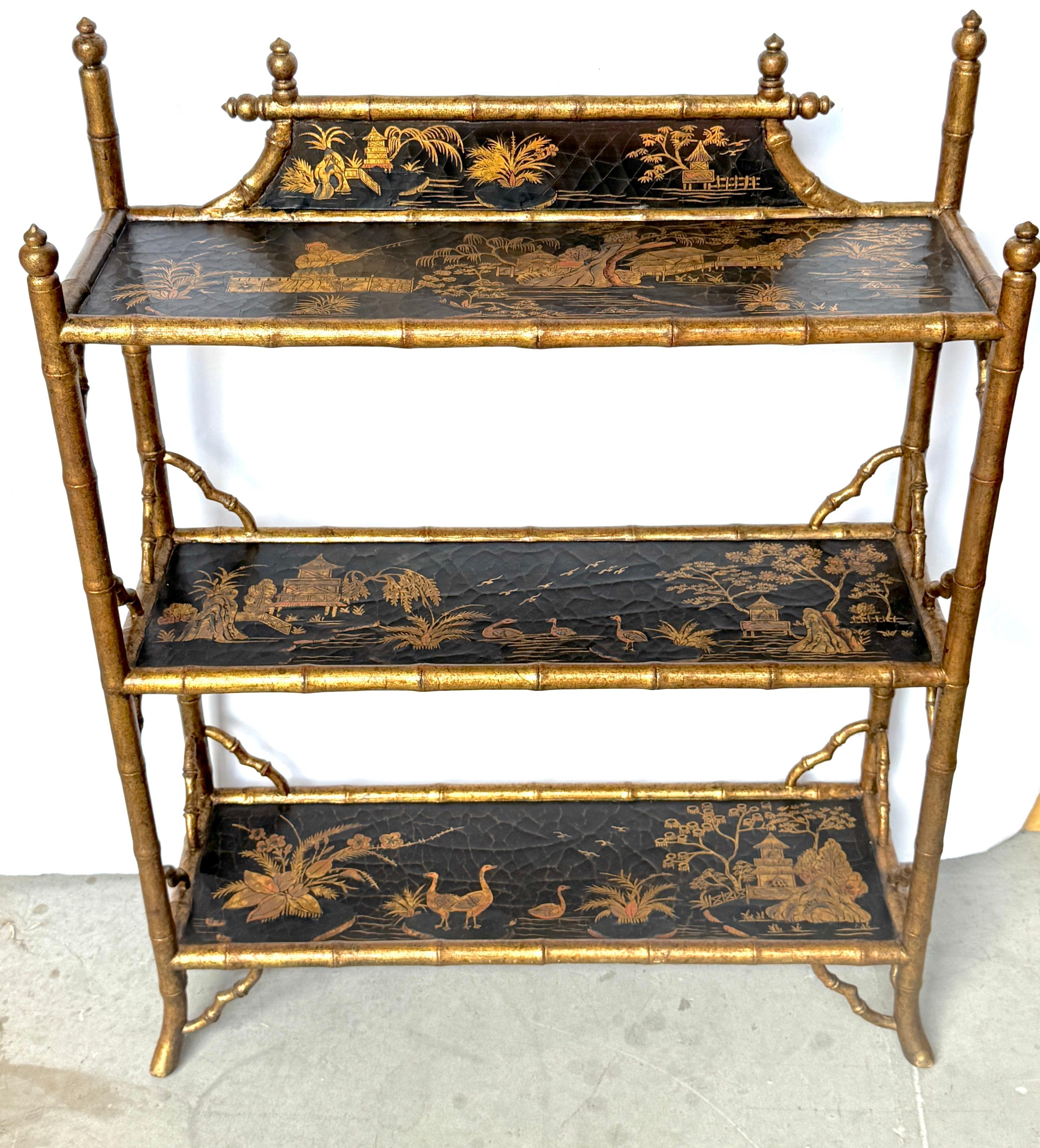 Stunning Chinoiserie Gilt Decorated Lacquered Three-Tier Bookcase/Wall Shelf, Italy, 20th Century 

This stunning 20th-century Chinoiserie gilt-decorated lacquered three-tier bookcase or wall shelf, made in Italy, exudes elegance and sophistication.
