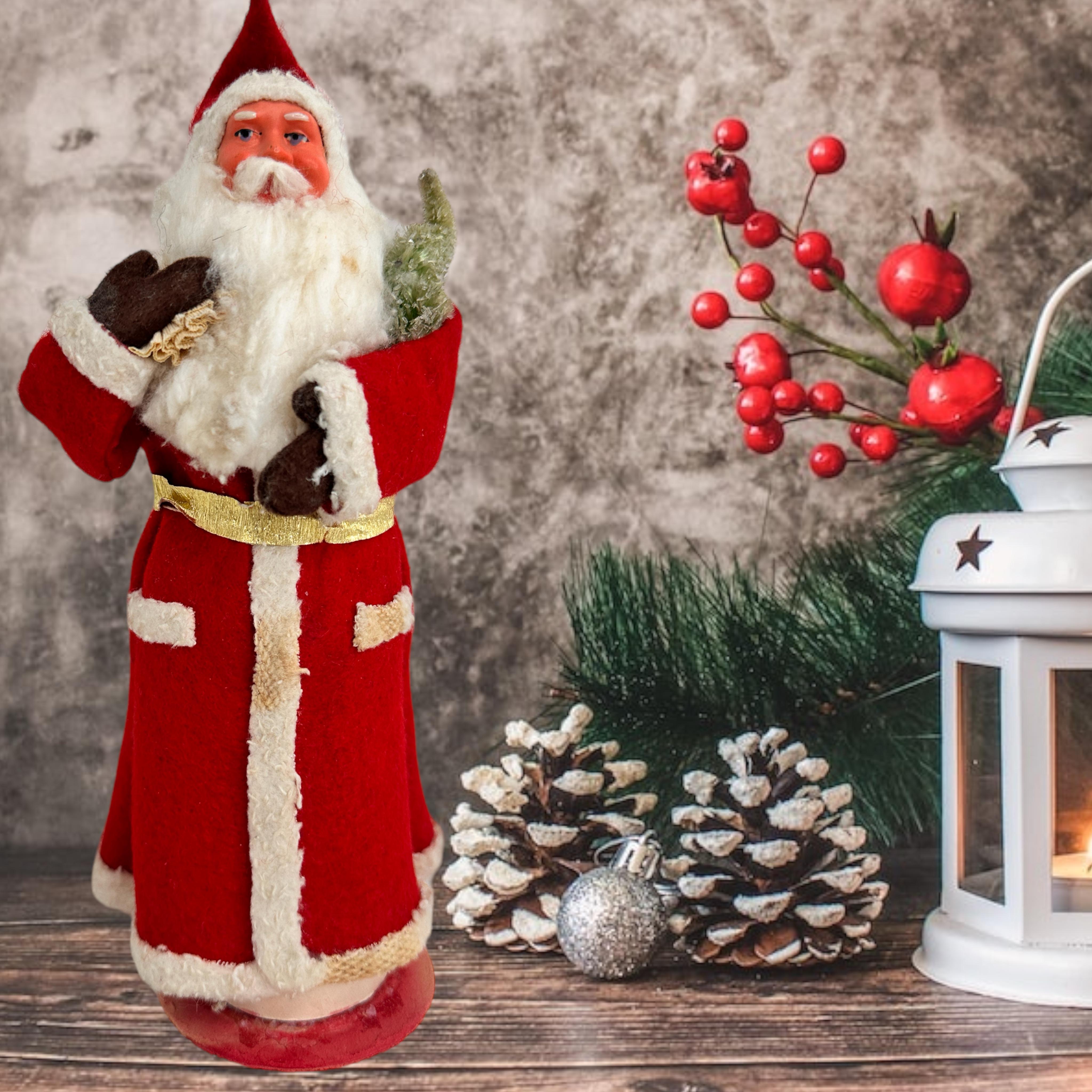 This vintage St.Nicholas, Santa Claus candy container made of composition, cardboard, felting and Papermache was made in the 20th century and is a charming addition to any Christmas collection. This original period piece was made in Germany and