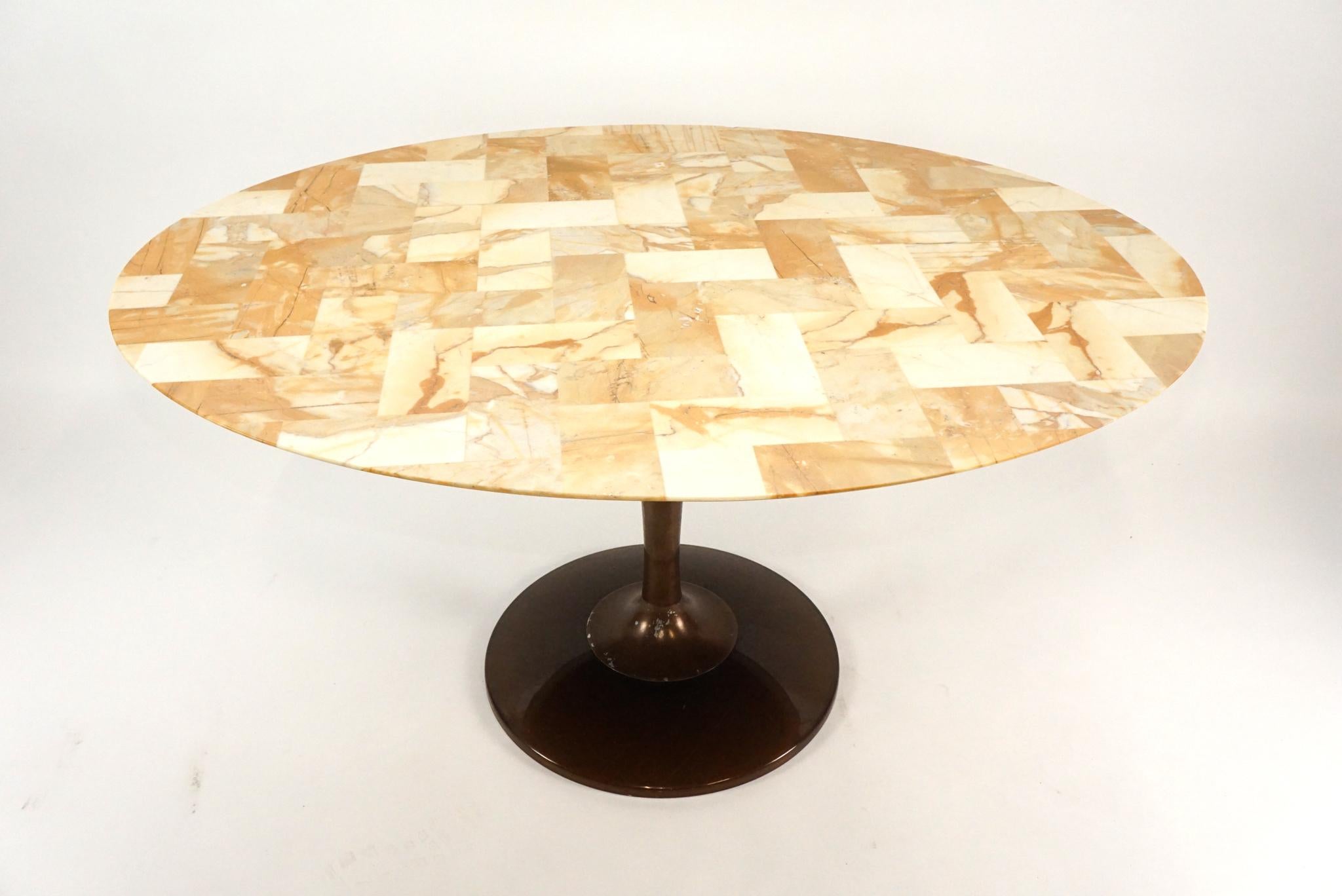 Amazing and rare version of the chrome craft table. A patchwork man-made 'marble' tabletop. Good original condition with a couple of chips on table edge. Noticeable only upon close inspection. Measure: 5'.
   
