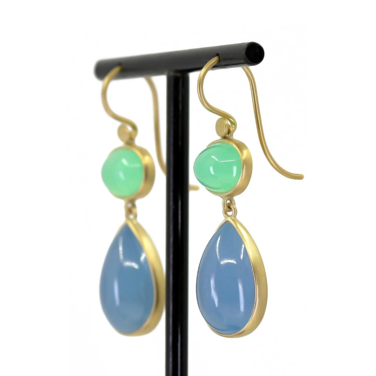 One of a Kind Drop Earrings by award-winning jewelry maker Lola Brooks, hand-fabricated in her signature-finished 18k yellow gold showcasing a gorgeous matched pair of pear-shaped aquamarine cabochons totaling 11.88 carats, bezel-set beneath an