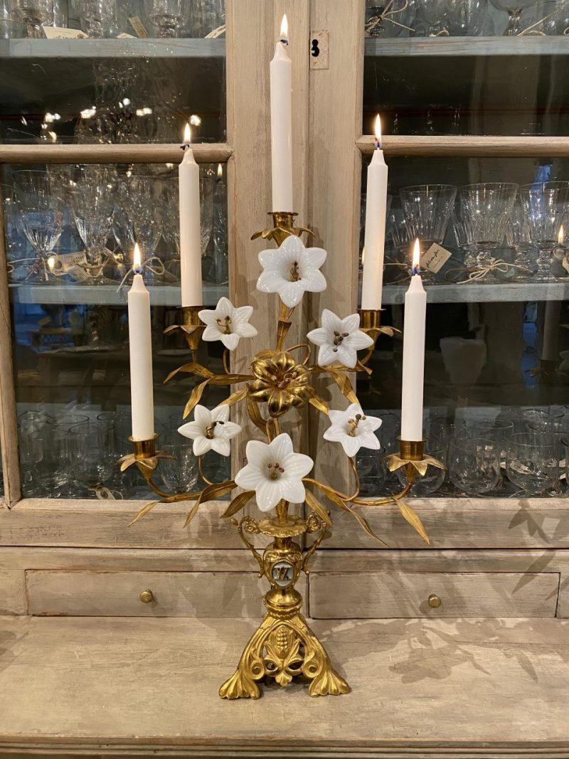 Wonderful antique candlestick / candelabra, beautifully decorated with one charming brass lilly, and white opaline glass lilies.

This religious candelabra dates back to circa 1900, originates from the Catholic Church in France.

Also known as