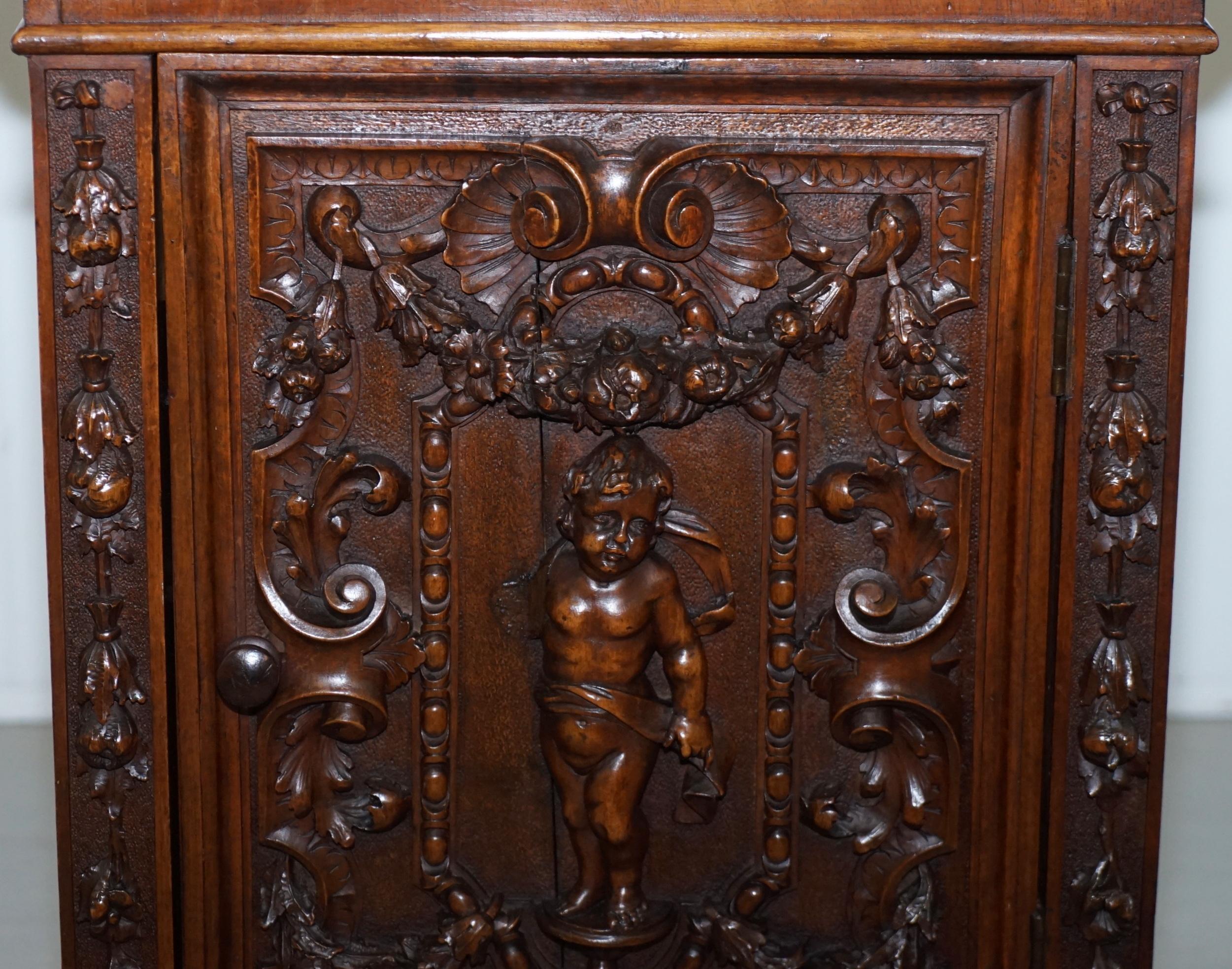 Hand-Crafted Stunning circa 1780 Carved Walnut Side Cabinet with Cherub & Floral Detailing
