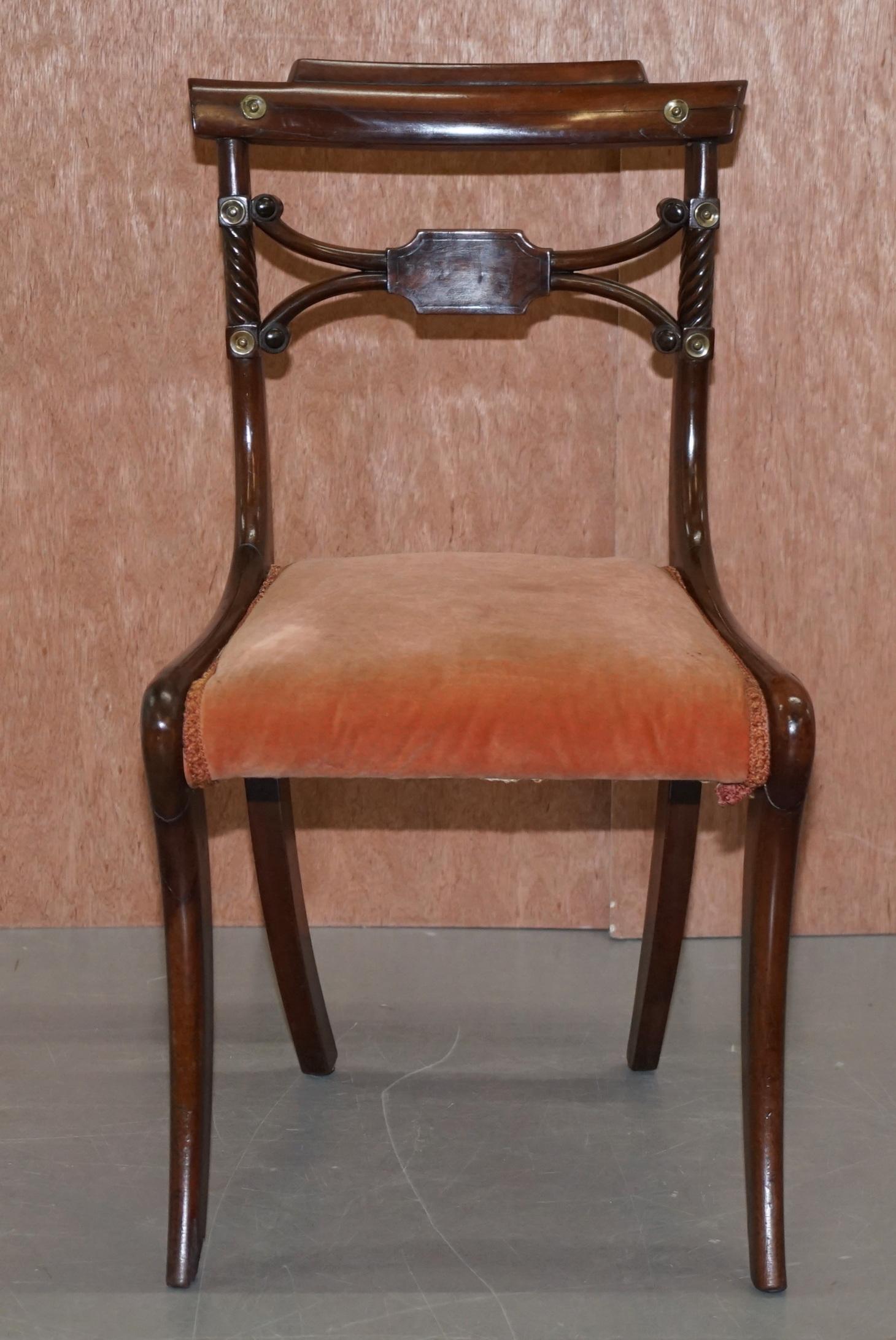 We are delighted to offer this sublime original Regency circa 1810-1820 sabre leg dining chair

A very well made chair, the frame is ornately carved in flamed mahogany, the craftsmanship is sublime 

This is one of the most iconic hand made in