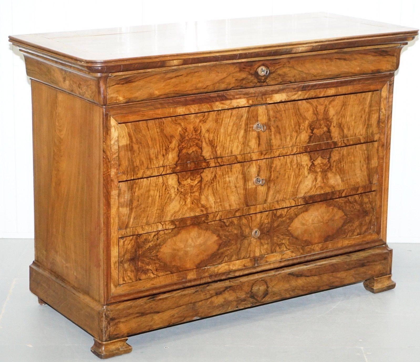 We are delighted to offer for sale this stunning Biedermier flamed walnut chest of drawers, circa 1850

A magnificent looking and well-made piece in lovingly restored condition throughout

The walnut veneer is some of the nicest most premium