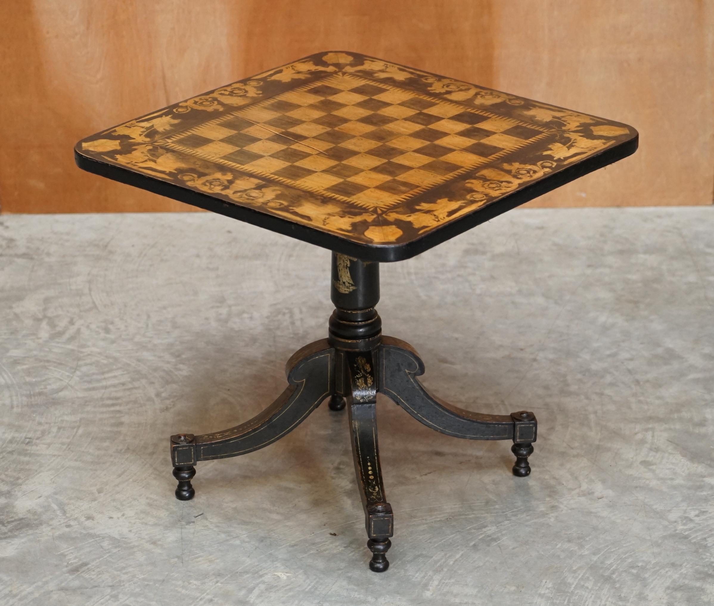 We are delighted to offer this lovely side table sized Victorian 1860 gold leaf ebonised Chess games table.

A very good looking well-made and function piece of furniture, extremely decorative, the top has gorgeous painting on it, which follows to