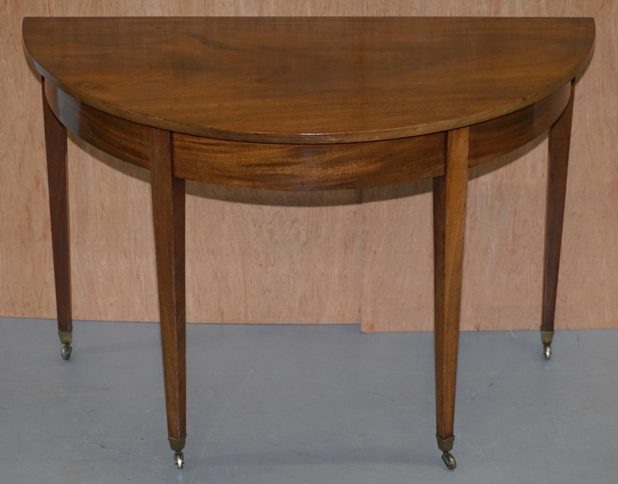 We are delighted to offer for sale this lovely Victorian walnut demilune console table

A very good looking well made and decorative piece, the timber patina is sublime, ideally suited it a hallway with a mirror above

We have lightly cleaned