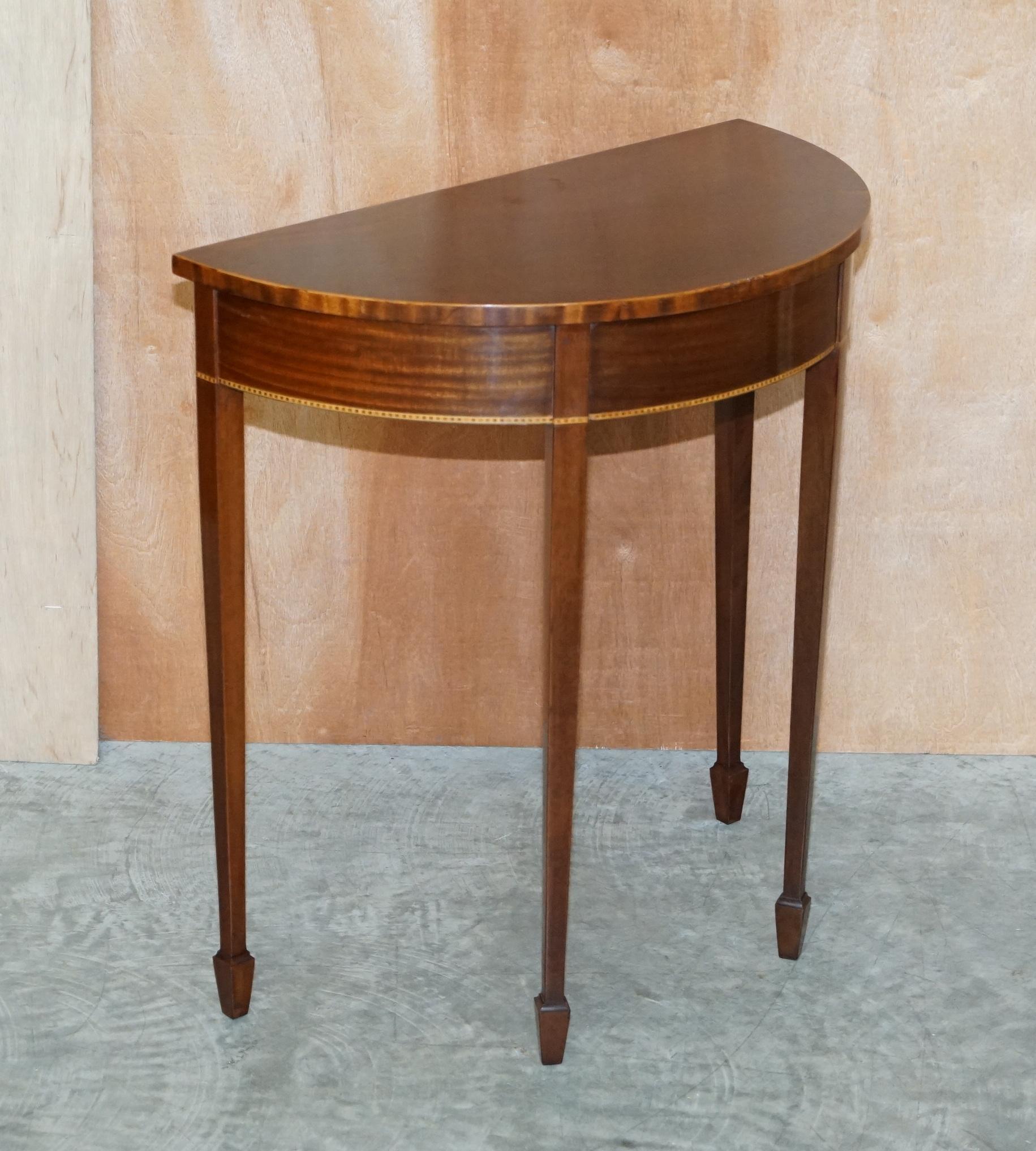 We are delighted to offer for sale this lovely hand made in England circa 1900 flamed mahogany demi lune console or side table with Satinwood crossbanded inlay 

A good looking well made a utilitarian console table, it is the very traditional French