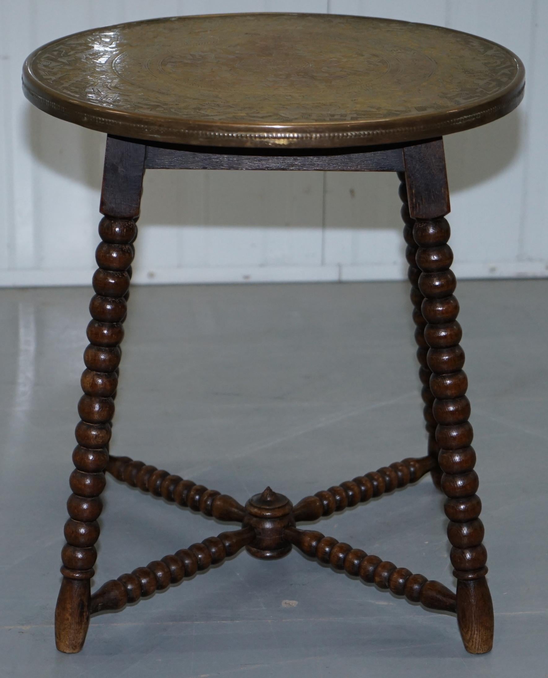 We are delighted to offer for sale this stunning circa 1900 oak bobbin turned side table with Islamic brass engraved tabletop

A very good looking well made and decorative piece, it dates back to circa 1900 which is when these pieces were first