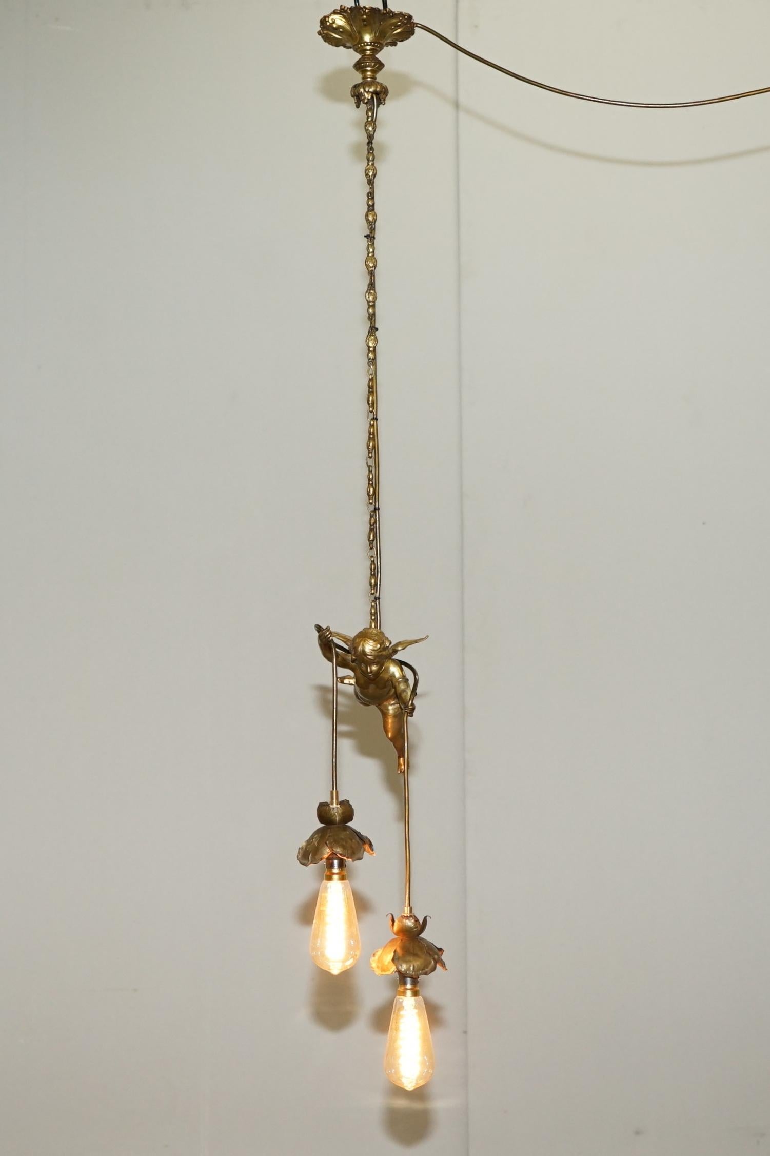 We are delighted to offer for sale this stunning circa 1920s French gold gilt bronze Cherub flying angel ceiling light

A very decorative ceiling light depicting a flying cherub, its all bronze with a gold gilt finish as mentioned, it is a very