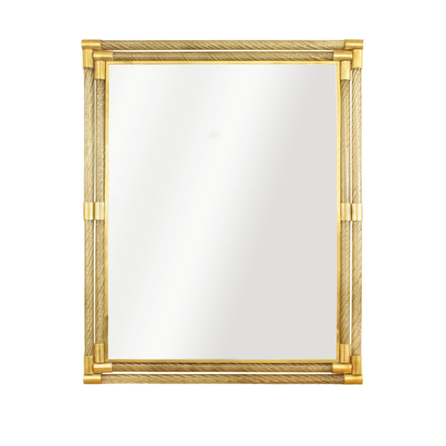 Bring luxury and elegance to your interior space with this Barovier & Toso inspired Murano glass, coiled double rod framed wall mirror with polished brass inset frame and etched brass cuff details at corners and midpoints along sides. Mirror's
