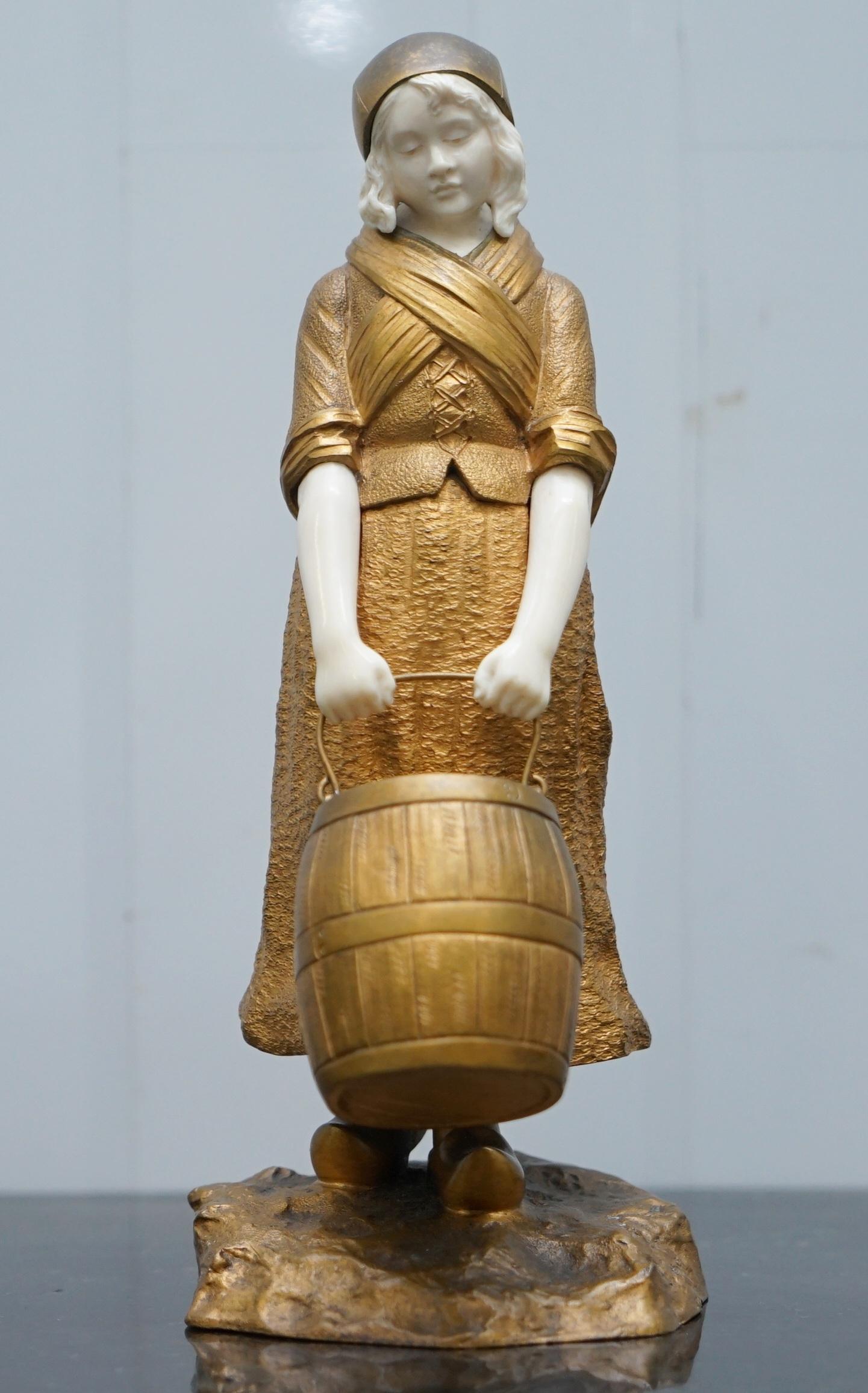 We are delighted to offer for sale this stunning very rare and highly collectable Dominique Alonzo gilt bronze statue of a young carrying a barrel 

I have two of these statues, the second young lady is listed under my others for sale and not