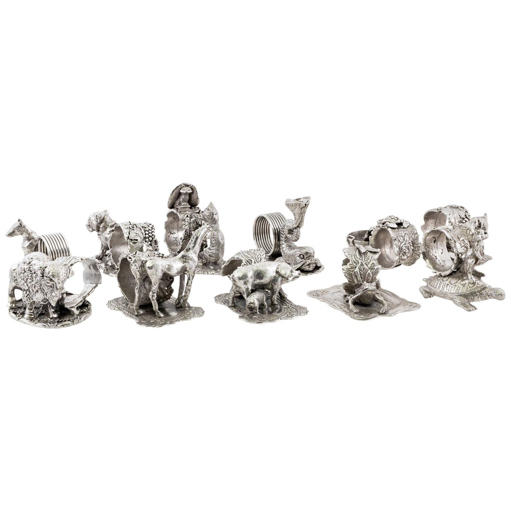 Stunning Collection of 11 Silver Plate Napkin Rings For Sale