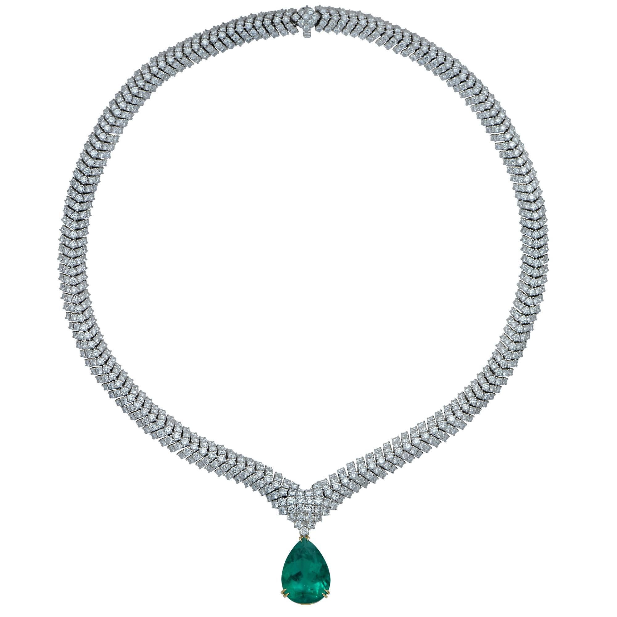 A magnificent 10.40ct rare Colombian Emerald, AGL certified, suspended from an elegant 18K white gold necklace containing 28.80cts of round brilliant cut diamonds F-G color and VS clarity. This vibrant emerald is removable making this breathtaking