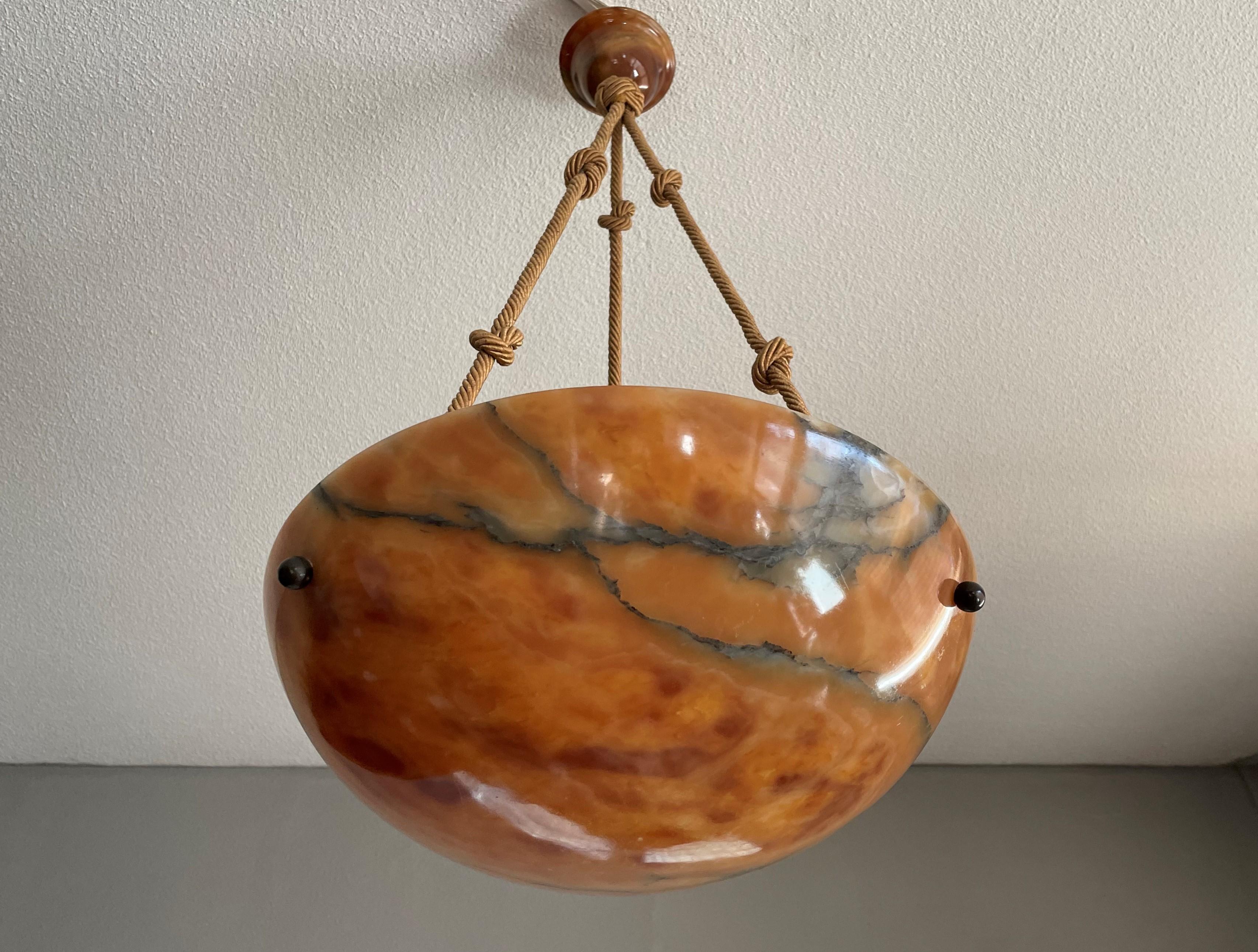 Practical size and beautiful design alabaster chandelier of museum quality and condition.

If you are looking for the best quality and condition antiques only then this incredibly beautiful alabaster pendant could be yours to own, use and enjoy