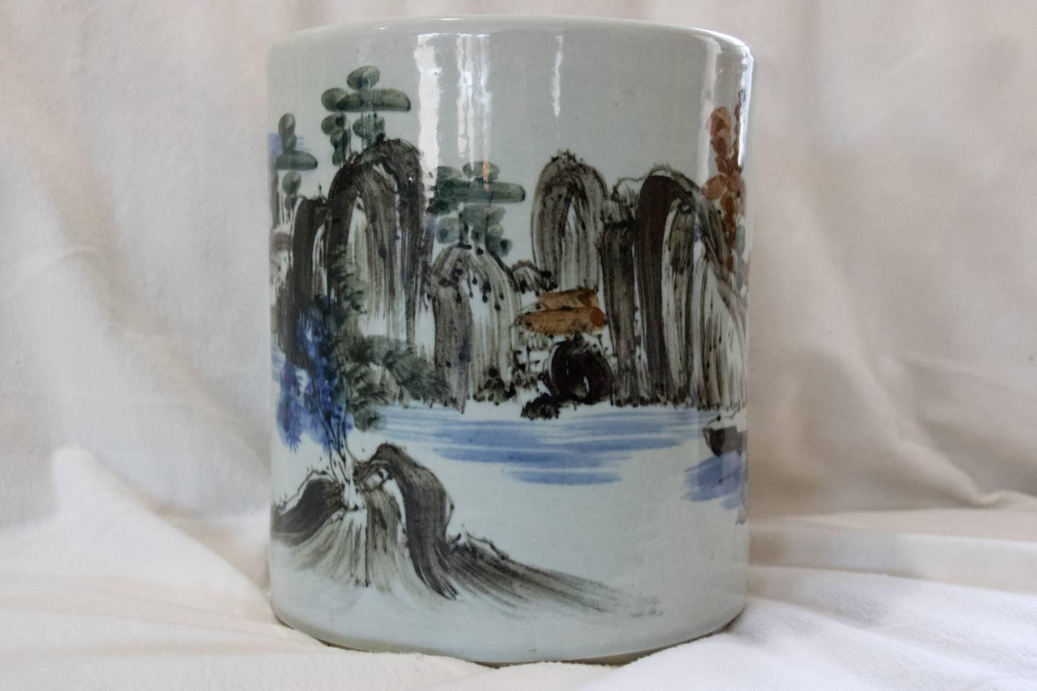 Stunning colors hand-painted Japanese stamped pottery beautiful art vase. Depicting a stunningly gorgeous mountainous water scene with burnt orange trees and rooftops and black sage mountains and stones, blue water and blue bushes, Japanese figures