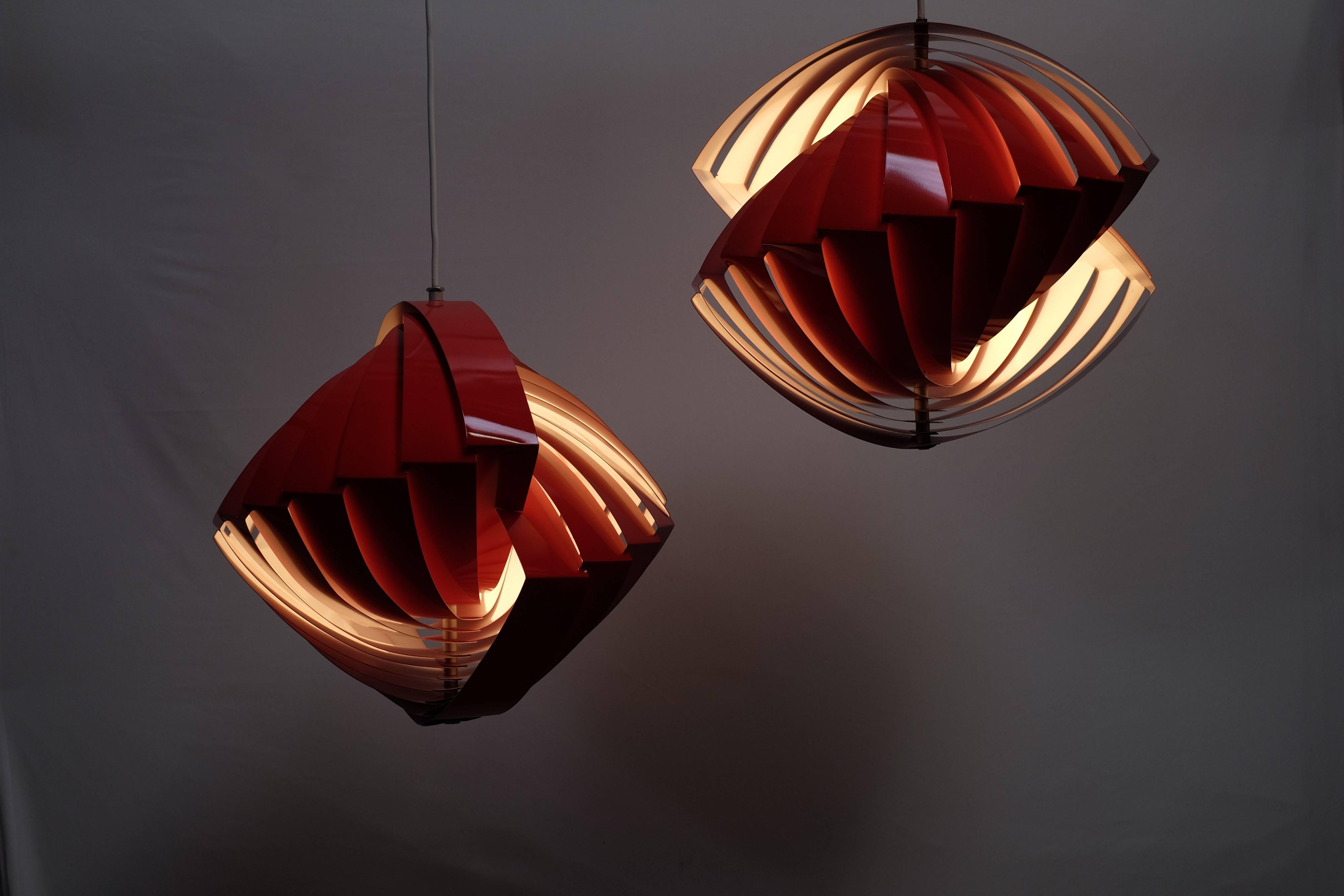 Amazing and iconic Danish lamp by Louis Weisdorf designed for Tivoli in Copenhagen.

The shape is like a round going spiral and the lamp is very interesting to spin - gives a cozy light. 
Great as a dining lamp, but also looks amazing in a