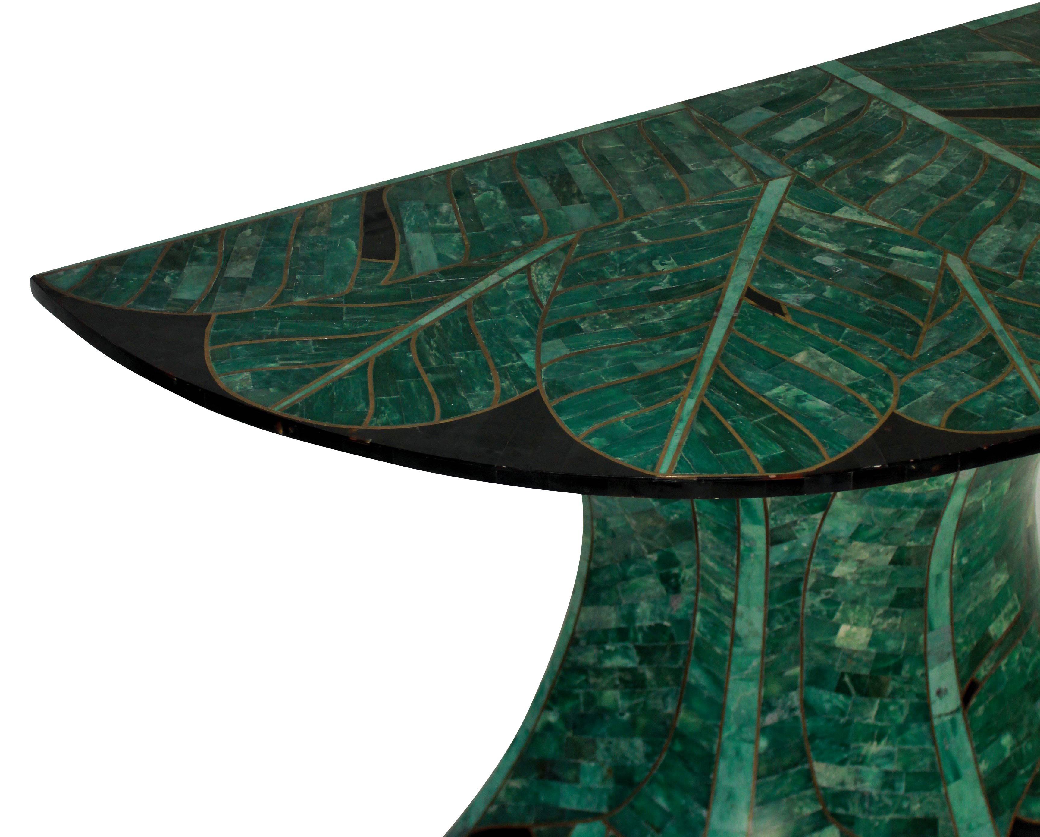 A stunning French console table, concave in shape of fine quality. With palm tree detailing in malachite and brass with black marble.

 