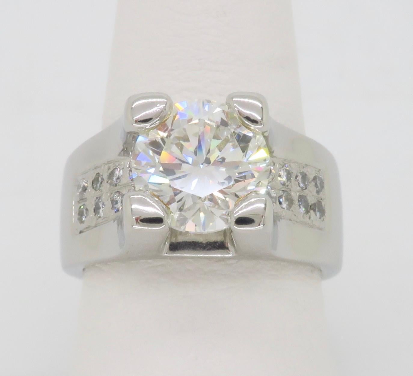 Stunning 3.36CTW Certified Diamond ring crafted in Platinum.

Center Diamond Carat Weight: 3.00CT
Center Diamond Cut: Round Brilliant Cut 
Center EGL Diamond Color: G
Center EGL Diamond Clarity: SI1
Certification: EGL LA: LA220800944
Total Diamond