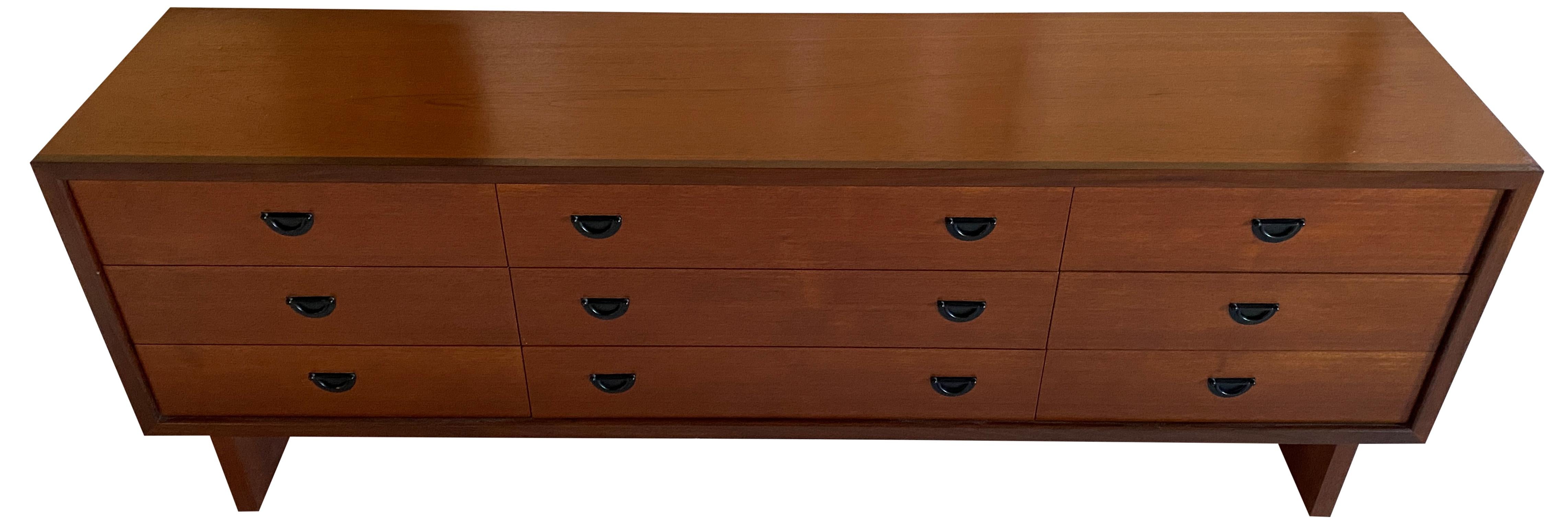 Stunning Danish Mid-Century Modern low 9 drawer dresser credenza black pulls. Impressive construction and very beautiful modern design. All 9 drawers slide smooth and very clean inside and out. Very unique teak dresser. Labeled R.S. Associates.